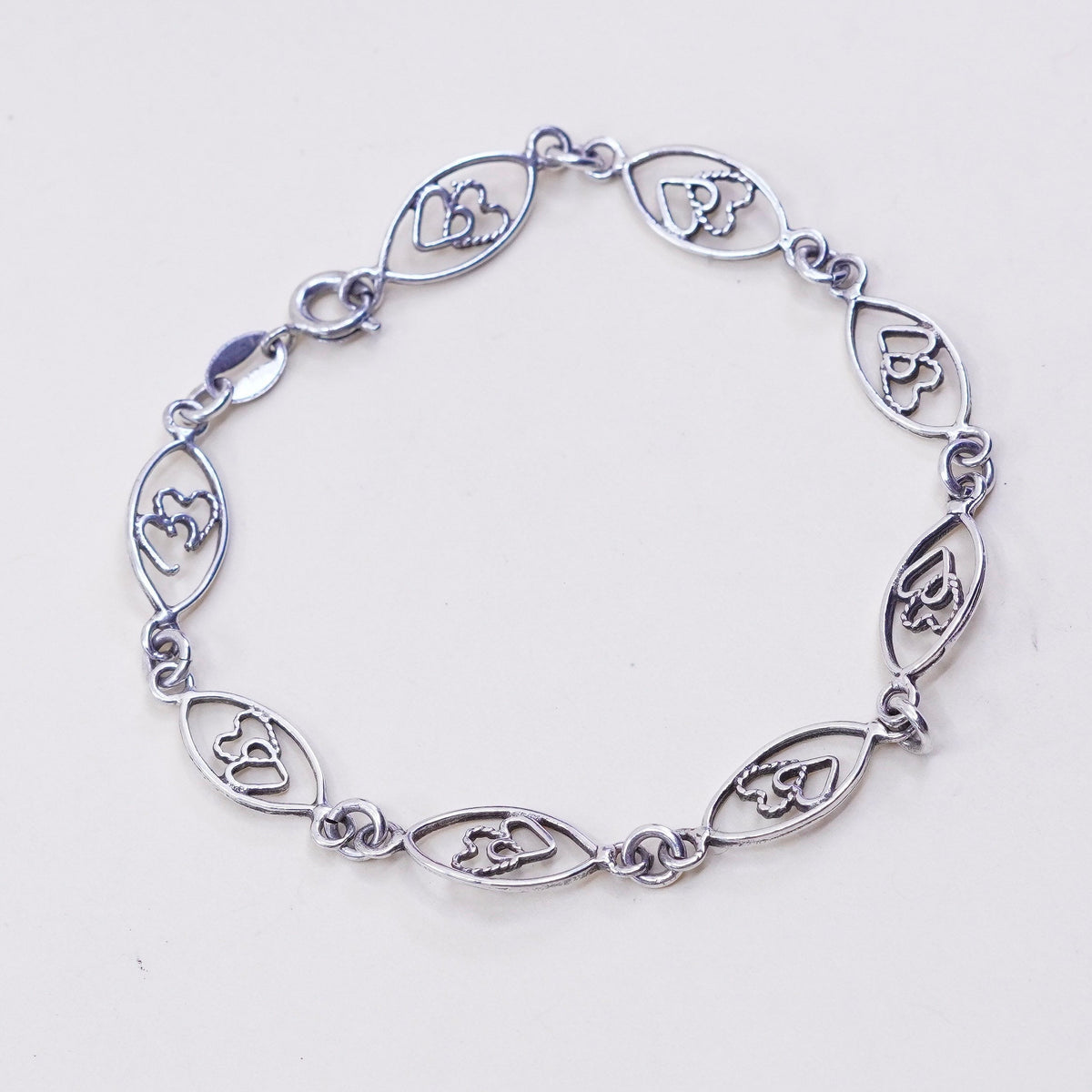 6.75”, sterling 925 silver Marquise shaped bracelet with double heart inside