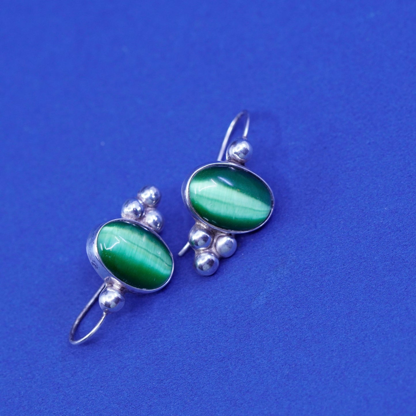 Sterling silver handmade earrings, mexico 925 with lime green cats eye and bead