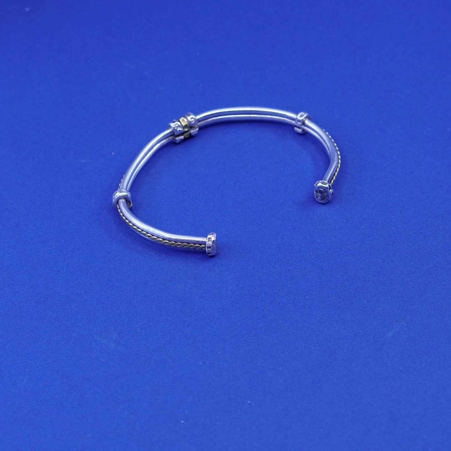 7.25”, two tone Sterling silver bracelet, ribbed 925 cuff with brass cable
