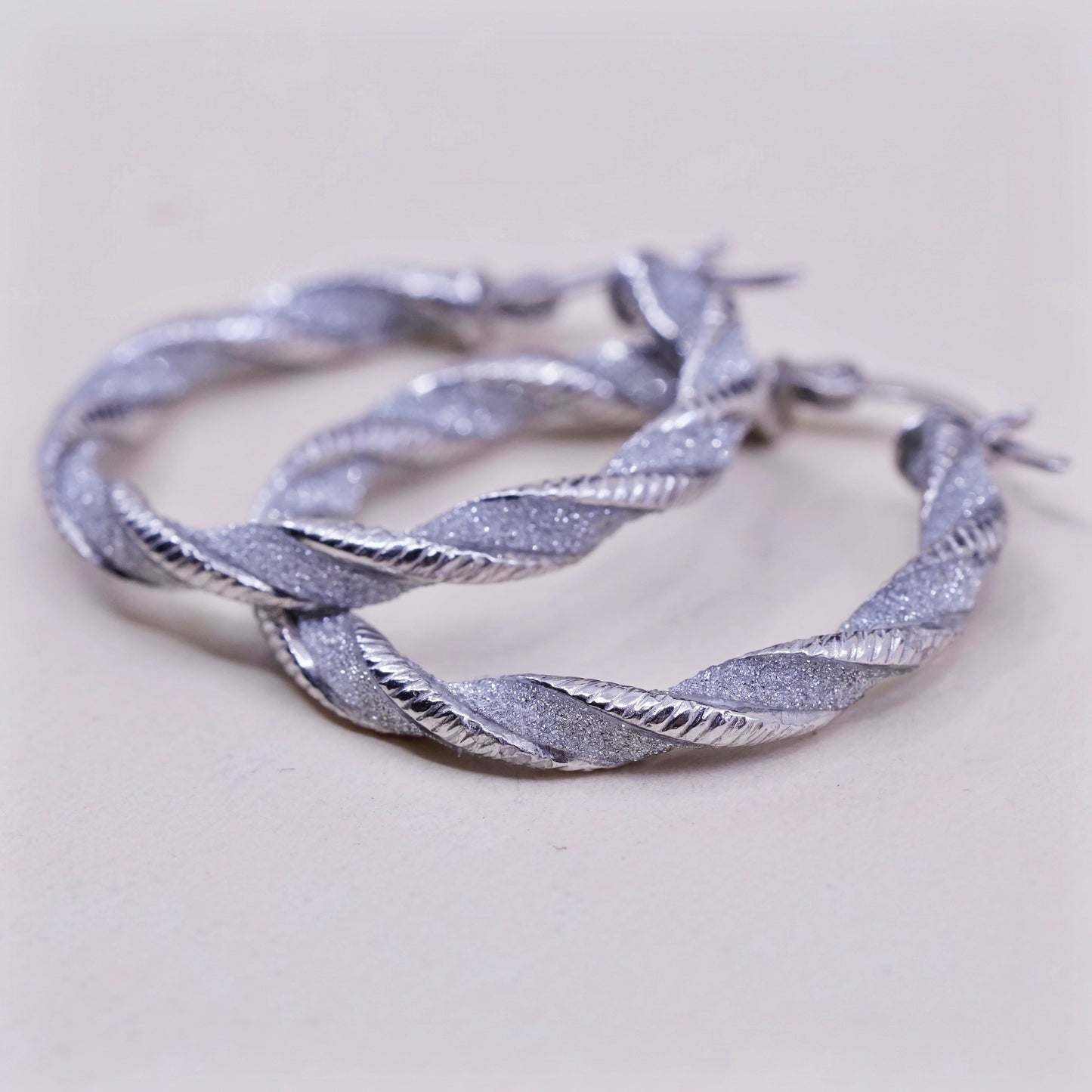 1.25”, sterling silver handmade earrings, 925 huggie, twisted glittering hoops