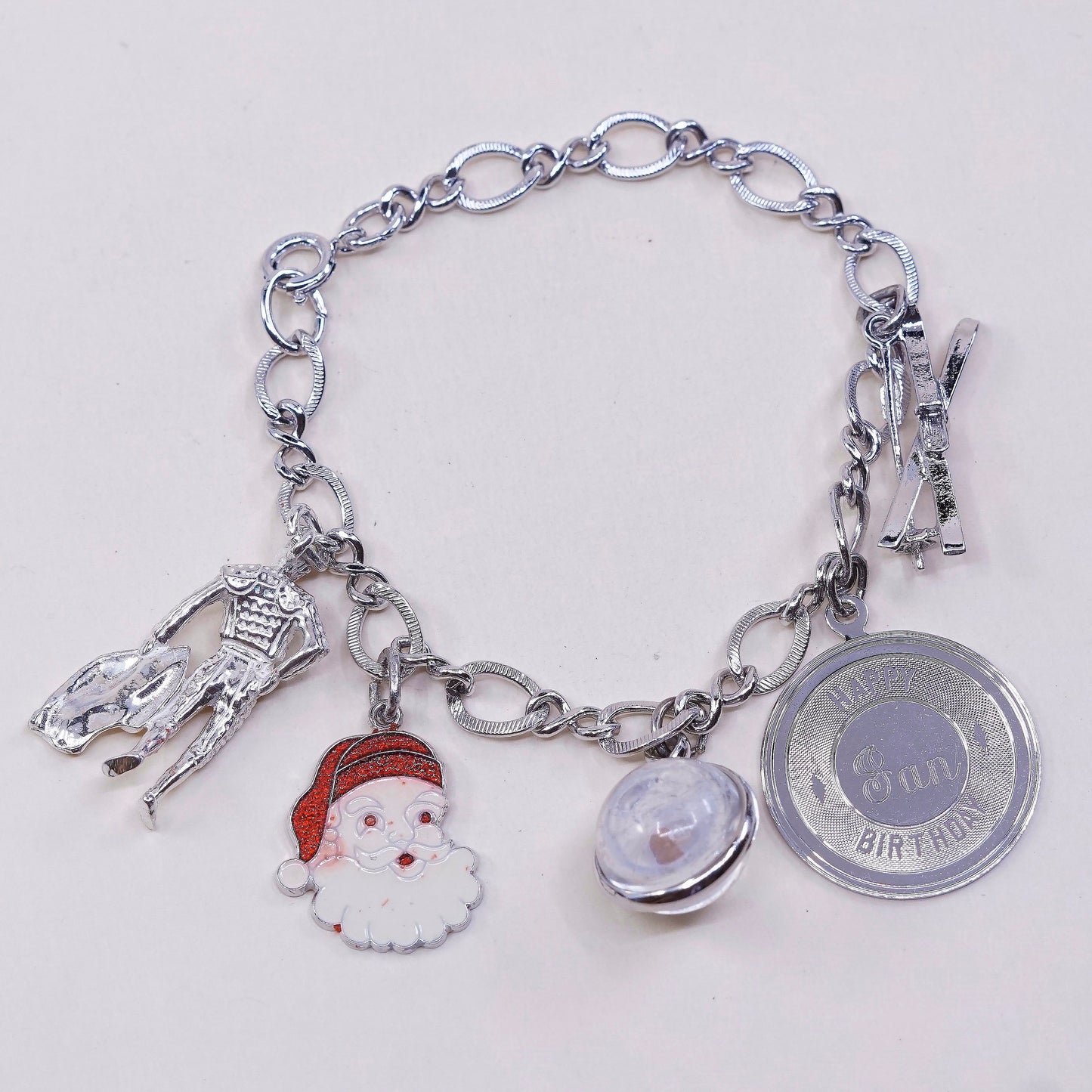 6.75”, vtg sterling 925 silver figaro, handmade bracelet w/ satan, matador, ski