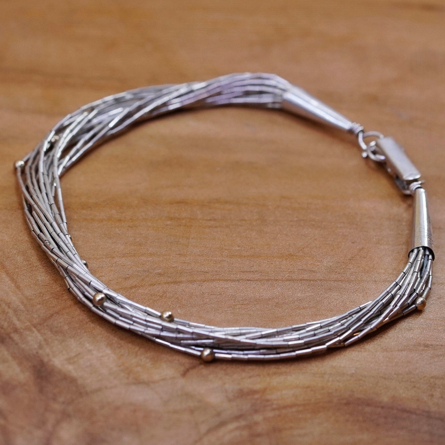 7”, 925 Sterling bracelet, 14 multi strands liquid Silver chain 14K gold bead