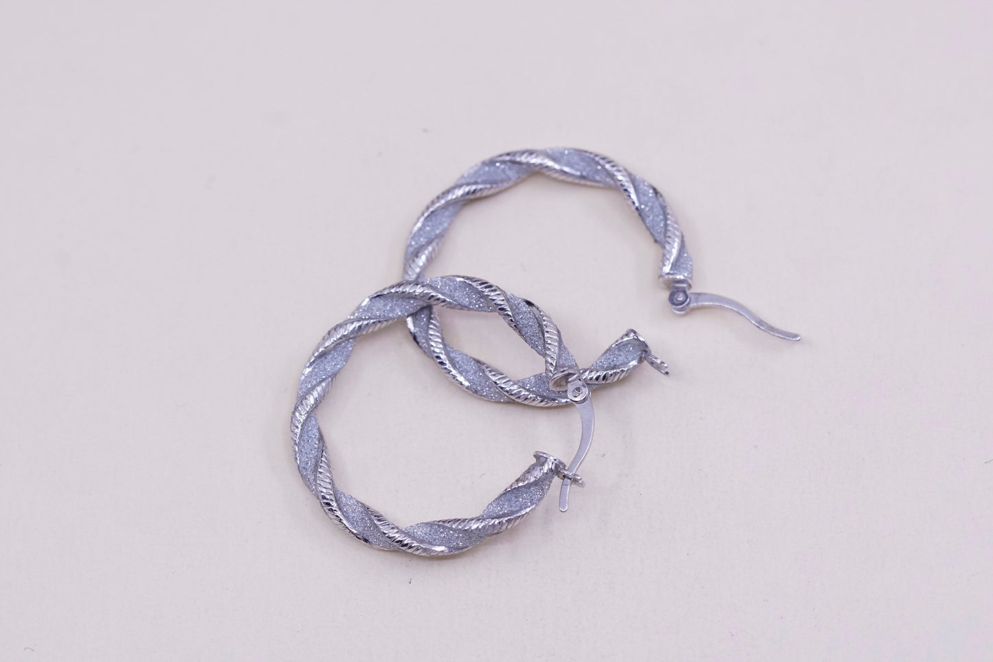 1.25”, sterling silver handmade earrings, 925 huggie, twisted glittering hoops