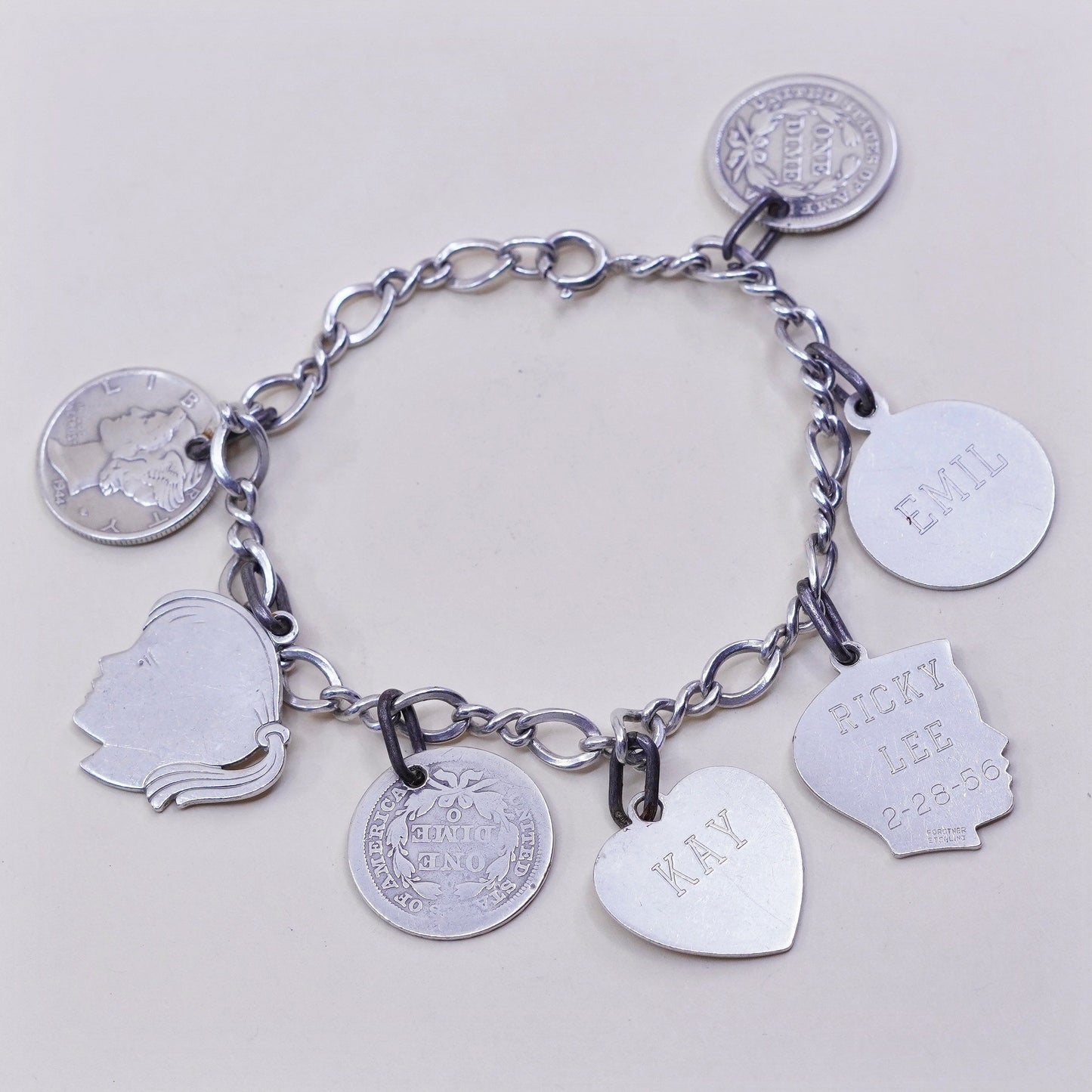 7”, sterling silver handmade bracelet, 925 Figaro chain w/ coin charms names