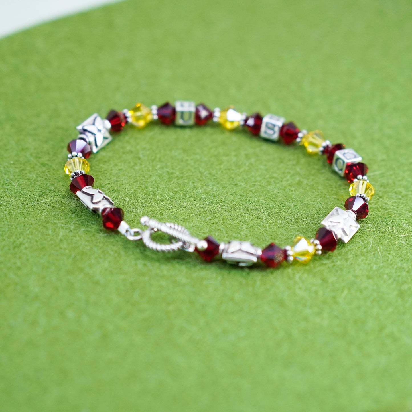 7”, vintage 925 sterling silver bracelet with red yellow crystal and USC cubes