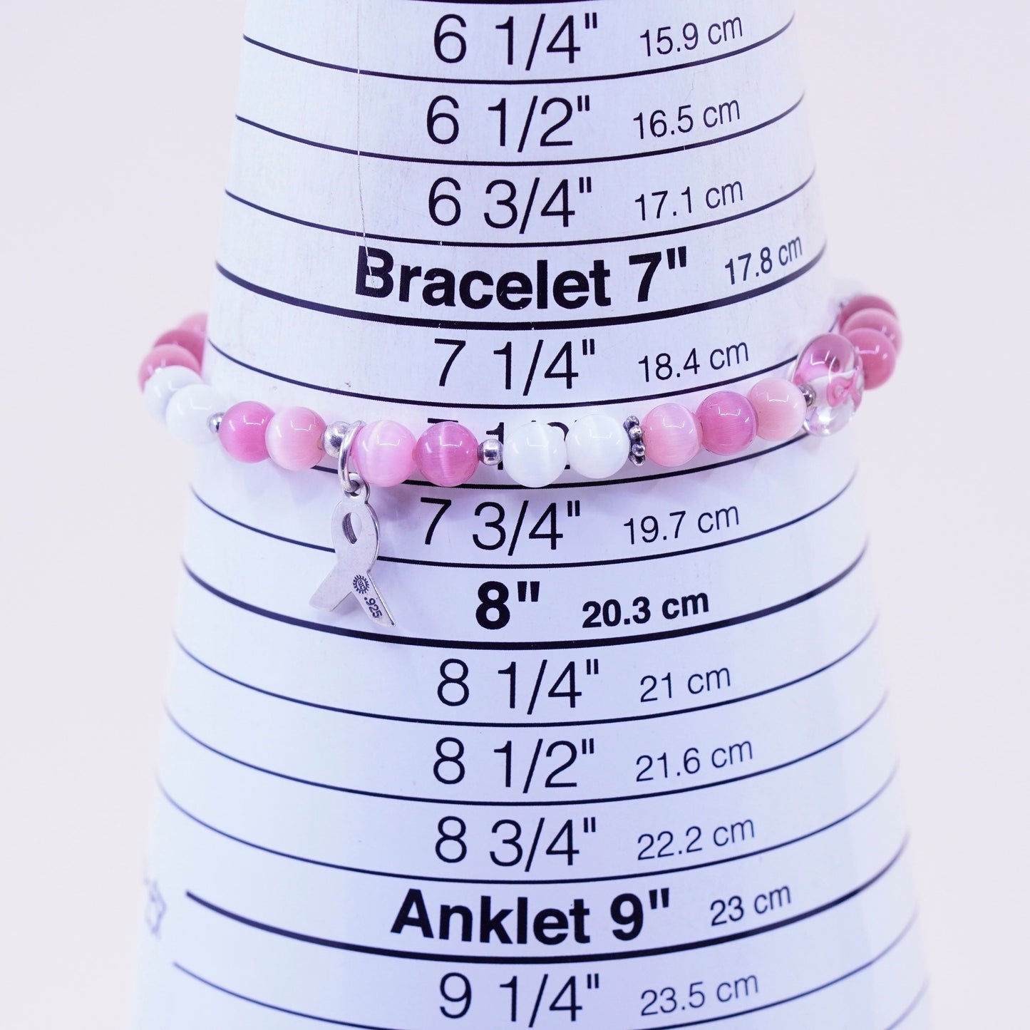 7.5”, “Hope” bracelet, pink cats eye beads elastic band 925 ribbon bow tie