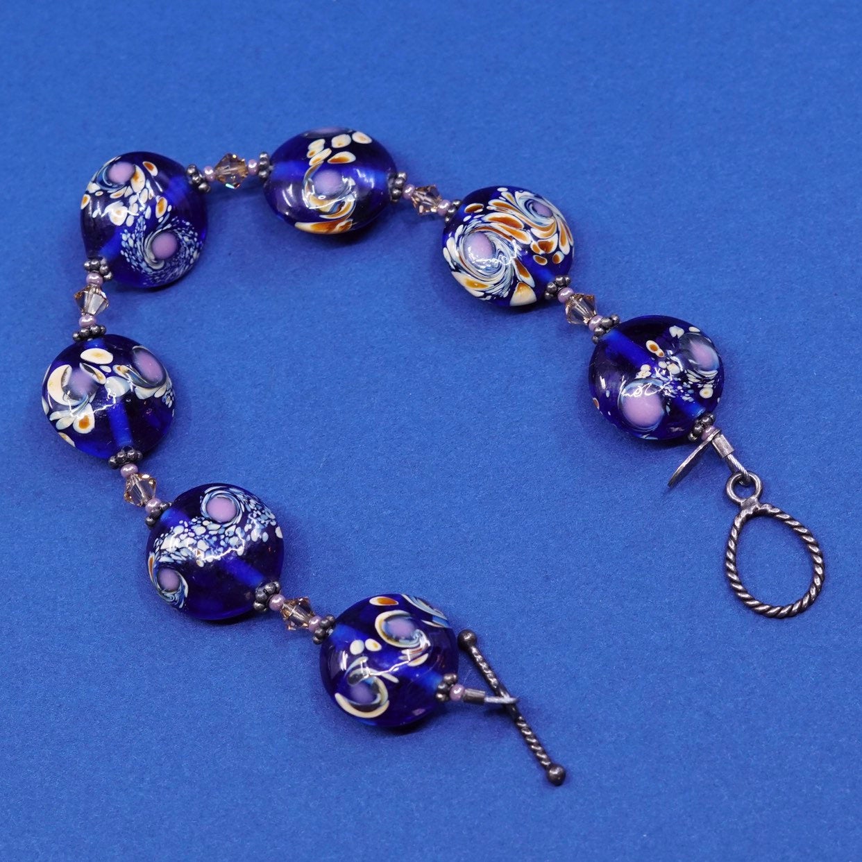 6.5", vtg handmade brass bracelet, brass toggle closure w/ flower glass beads