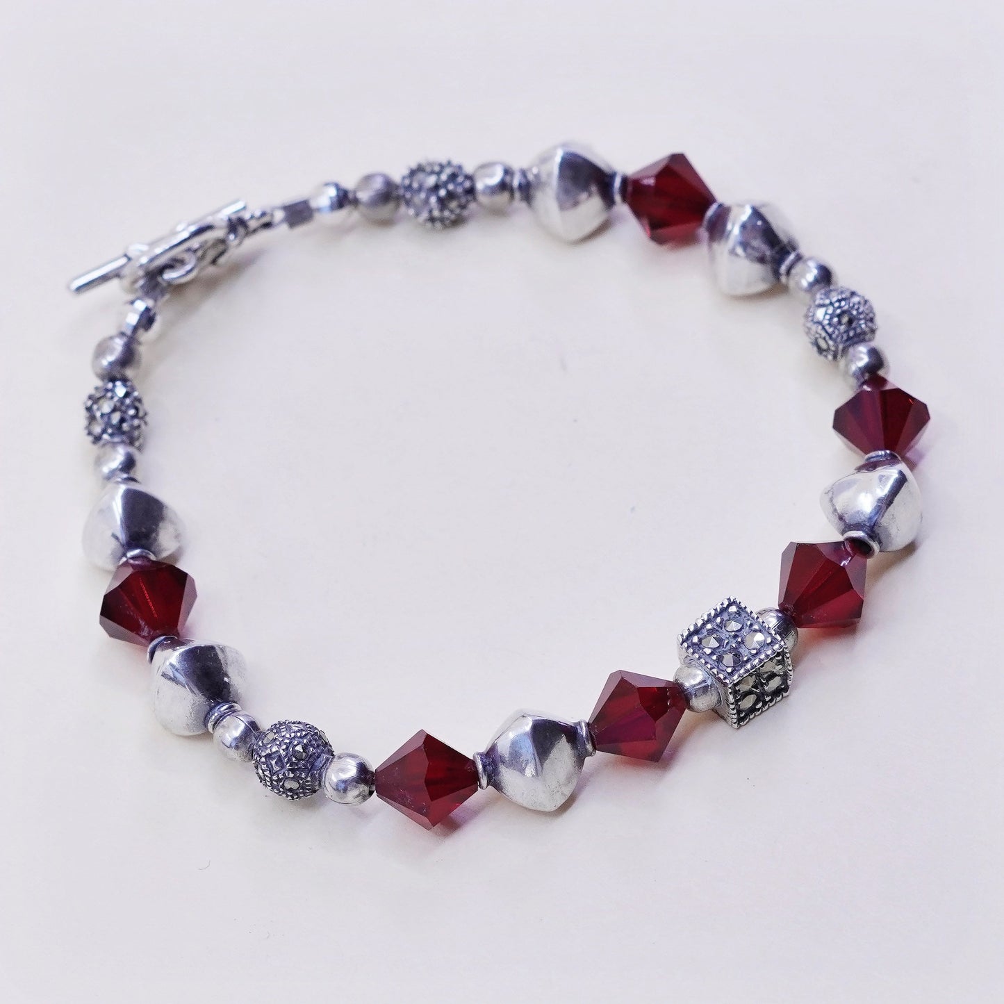 6.75”, handmade bracelet, ruby with sterling 925 silver beads N toggle closure