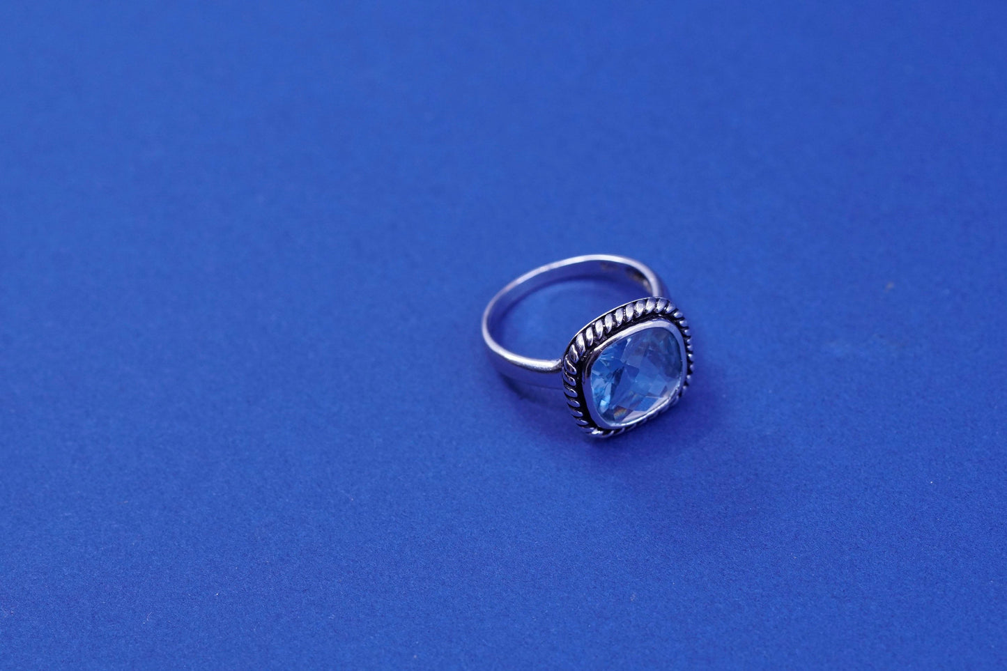 Size 7.75, vintage sterling 925 silver handmade ring with blue topaz and cable