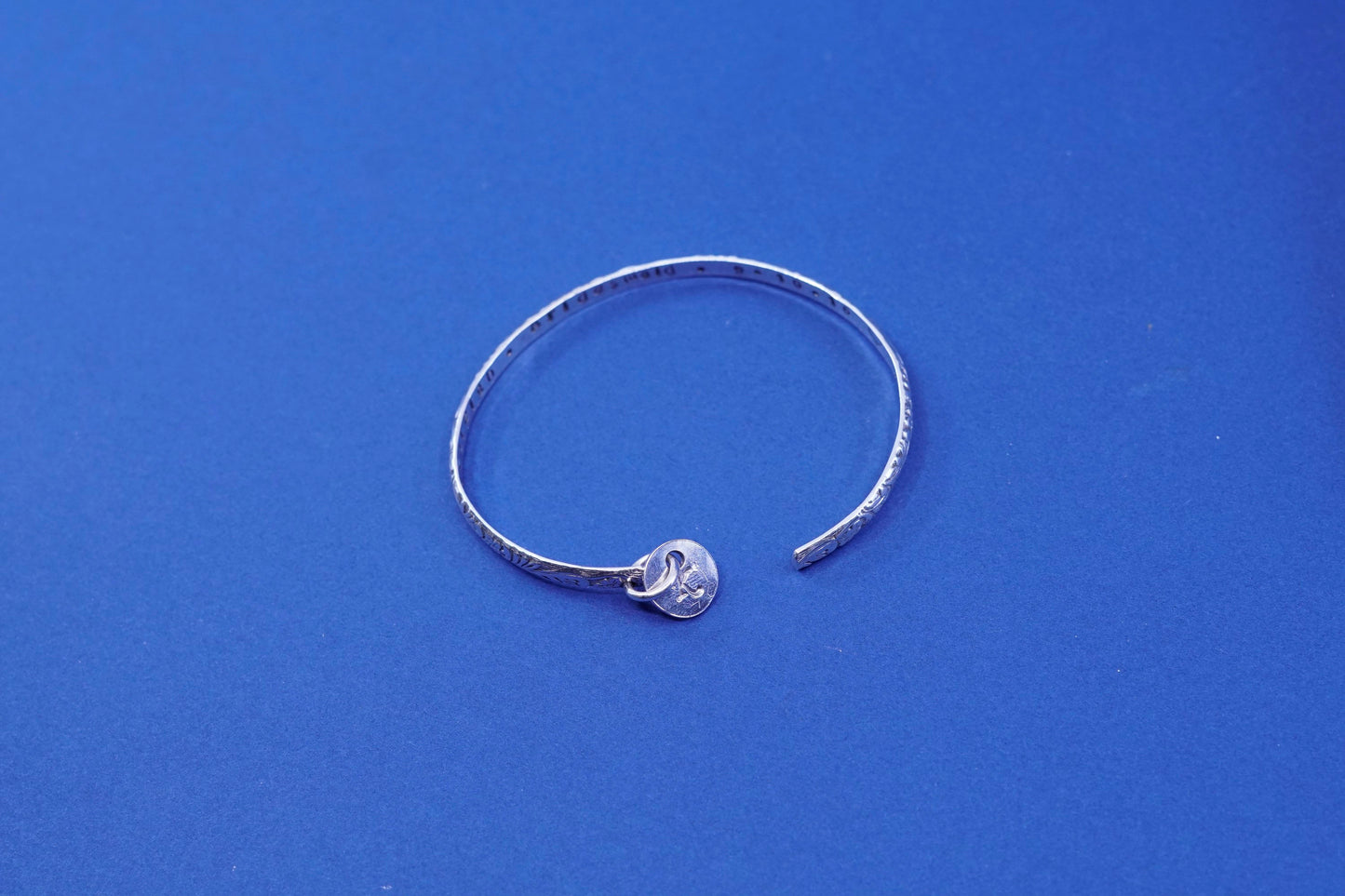 6.75”, sterling silver handmade bracelet, 925 textured cuff w/ “K” charm