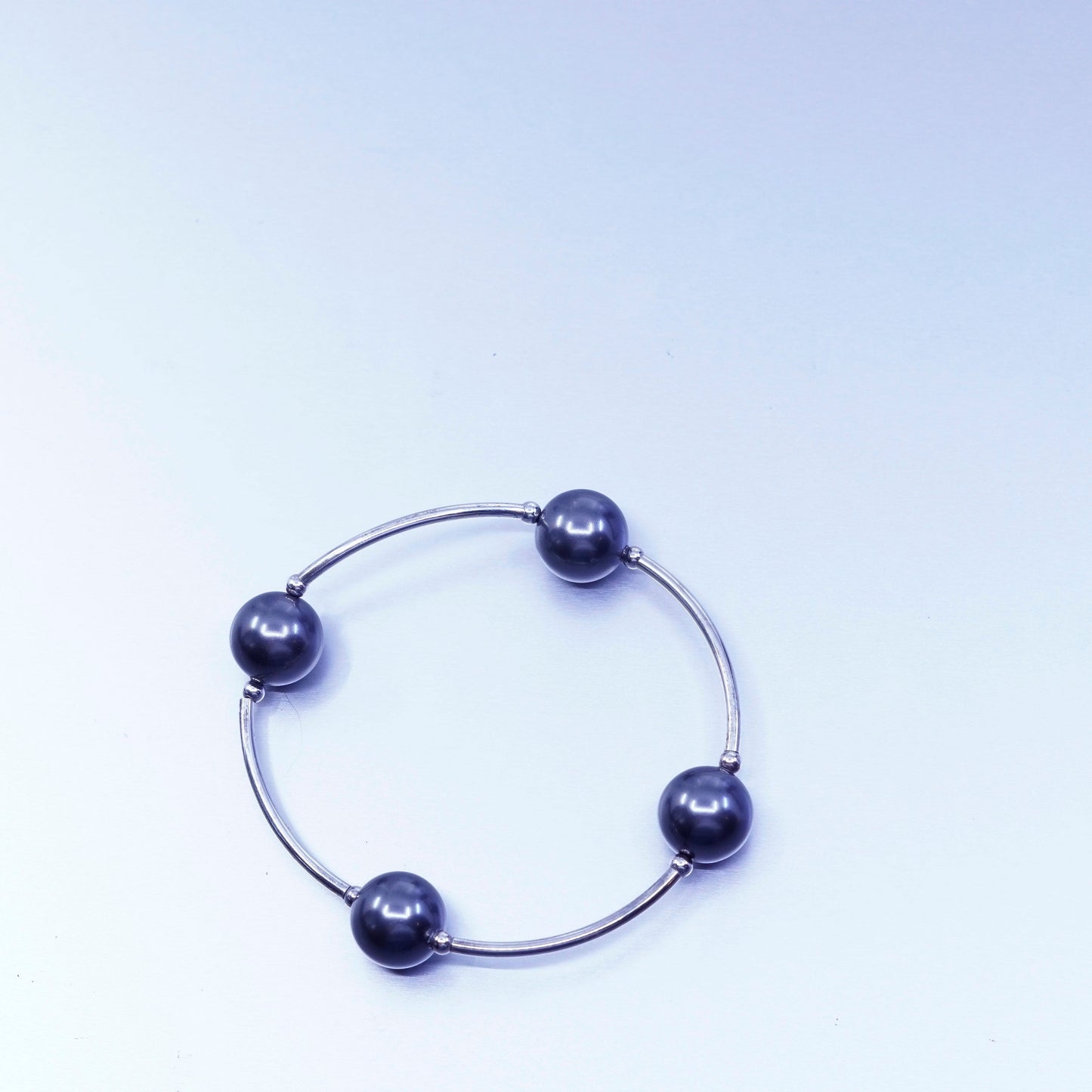 6.25”, Sterling 925 silver curvy bar bracelet with black pearl and elastic band