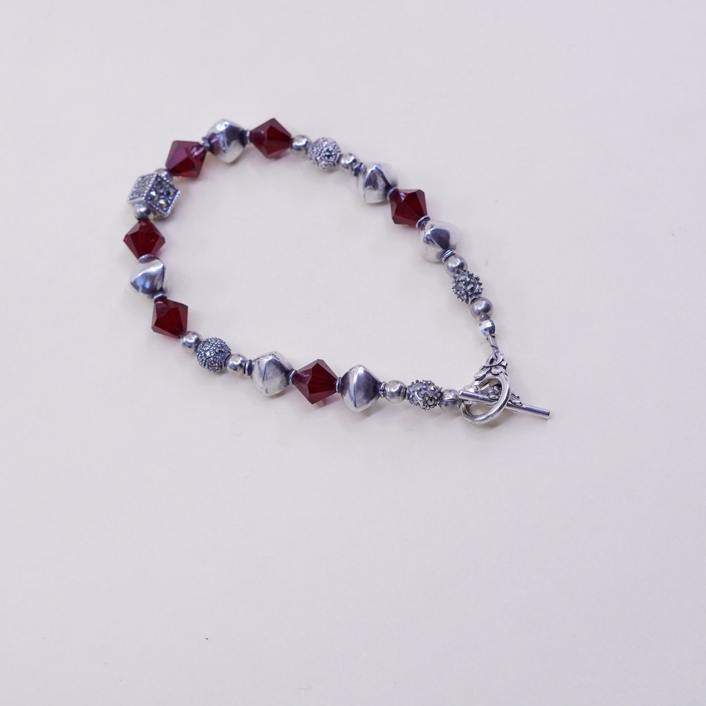 6.75”, handmade bracelet, ruby with sterling 925 silver beads N toggle closure