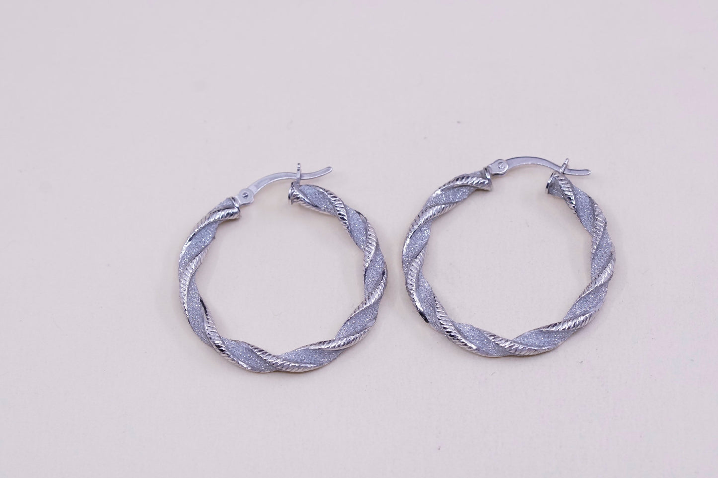 1.25”, sterling silver handmade earrings, 925 huggie, twisted glittering hoops