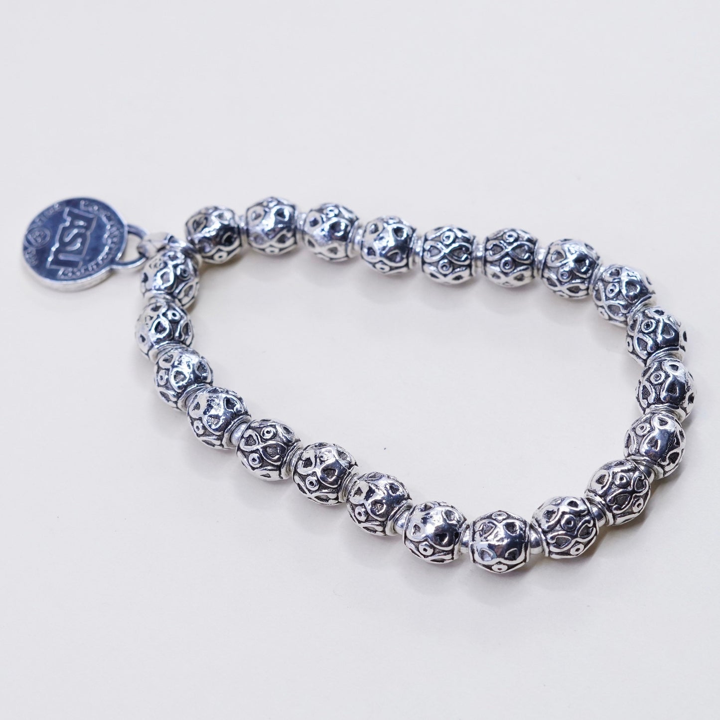 6.75”, sterling 925 silver handmade elastic bracelet textured beads N ASU charm