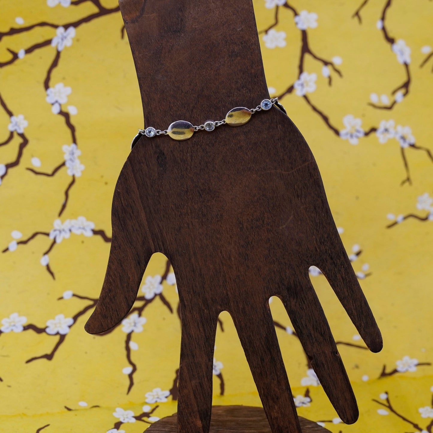 7.25”, Sterling silver bracelet, 925 oval chain with 10K gold charm and topaz