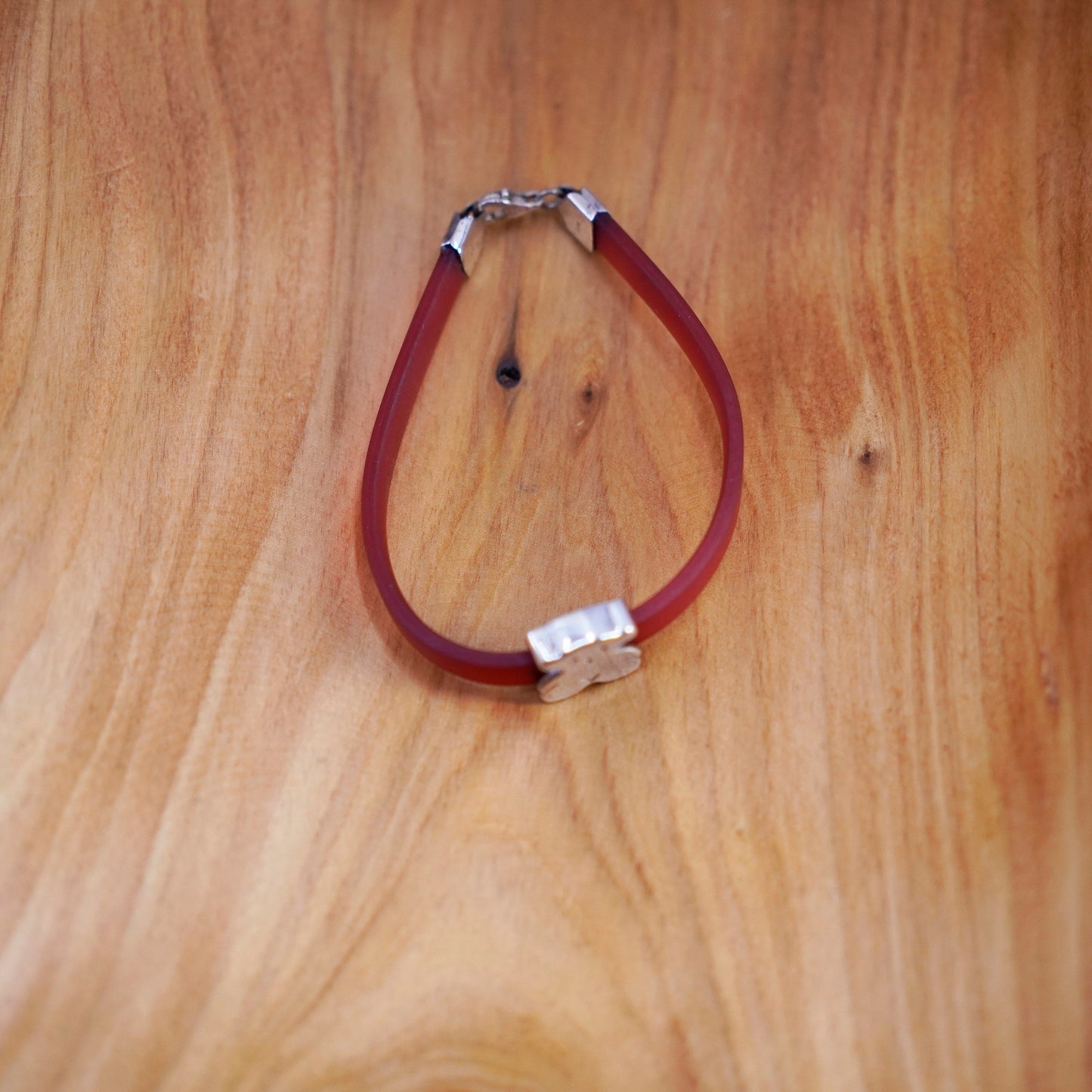 6.5”, vintage AG red rubber bracelet with sterling 925 silver teddy bear charm