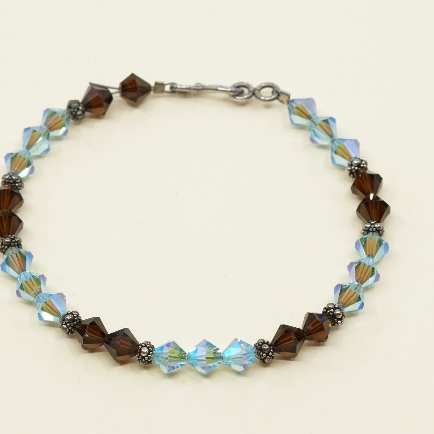 7.5”, VTG Sterling silver handmade bracelet w/ brown N blue Swarovski crystal