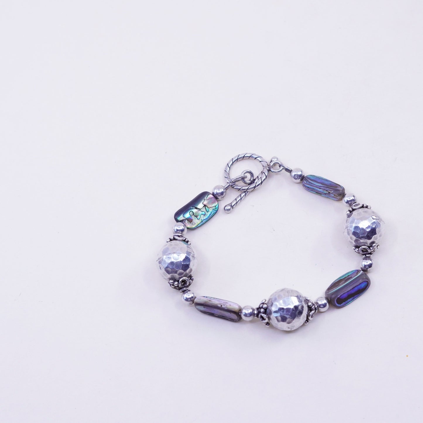 6.25”, vintage Sterling 925 silver bracelet, with hammered abalone beads