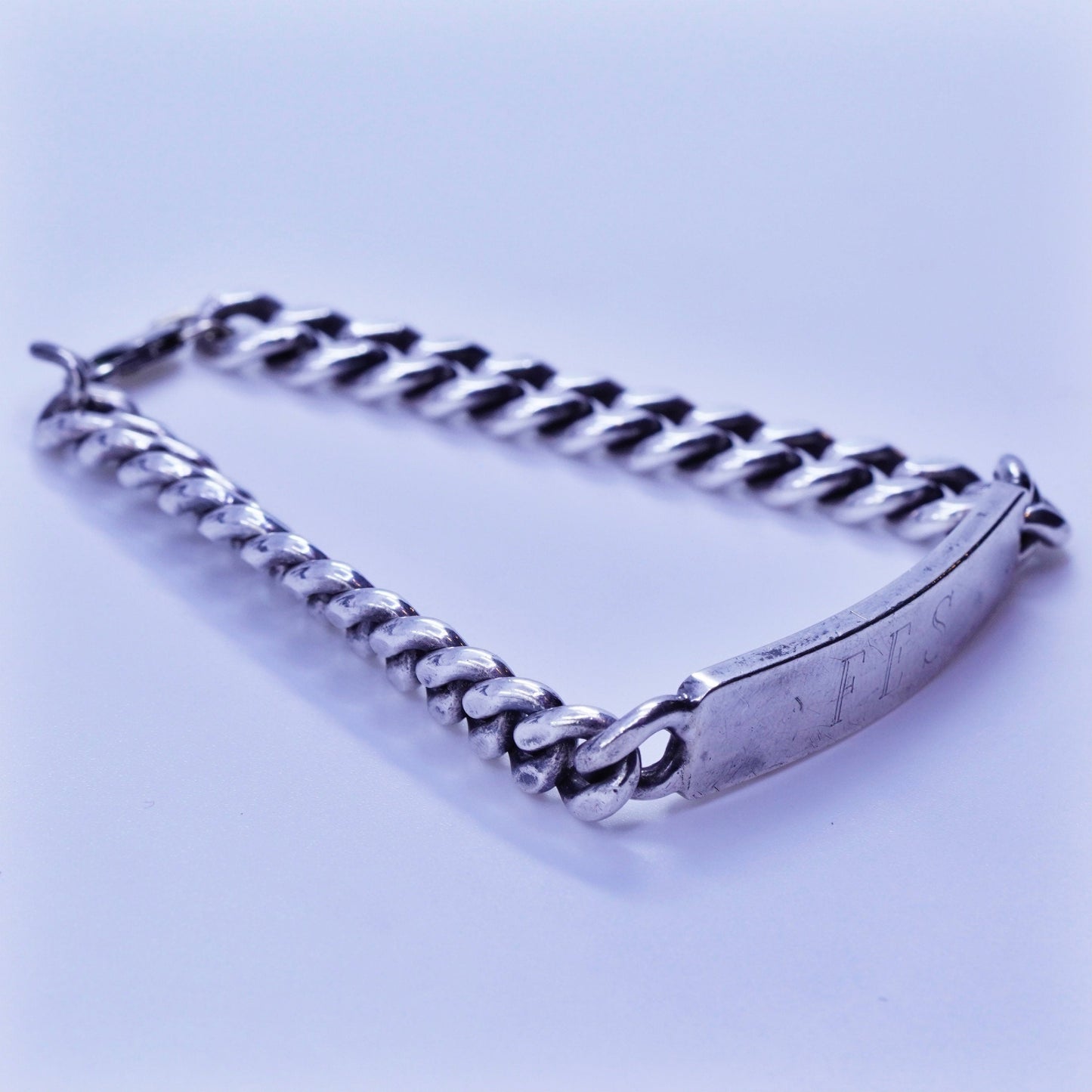 7.5”, doskow Sterling silver bracelet, 925 curb chain name tag engraved “FES”