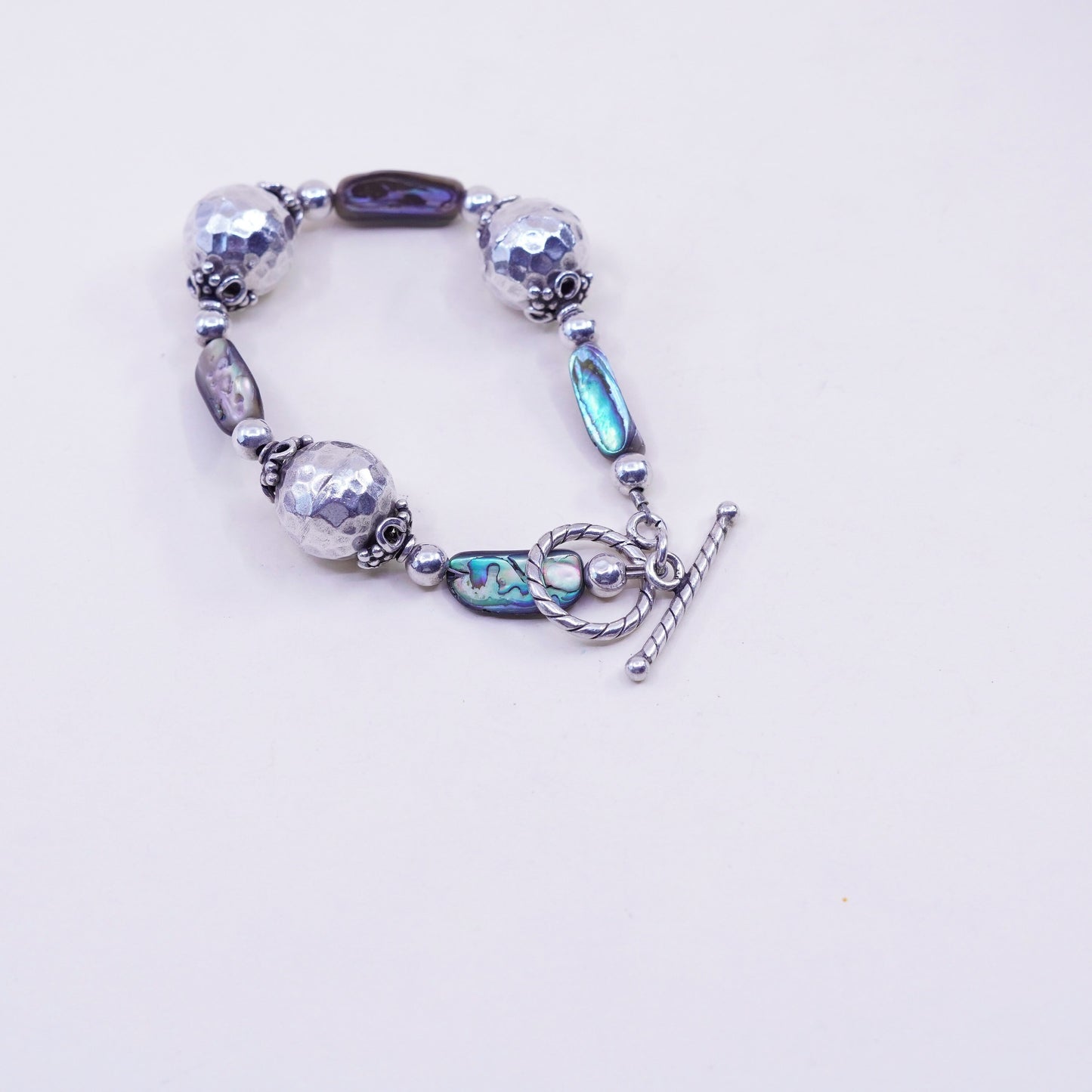 6.25”, vintage Sterling 925 silver bracelet, with hammered abalone beads