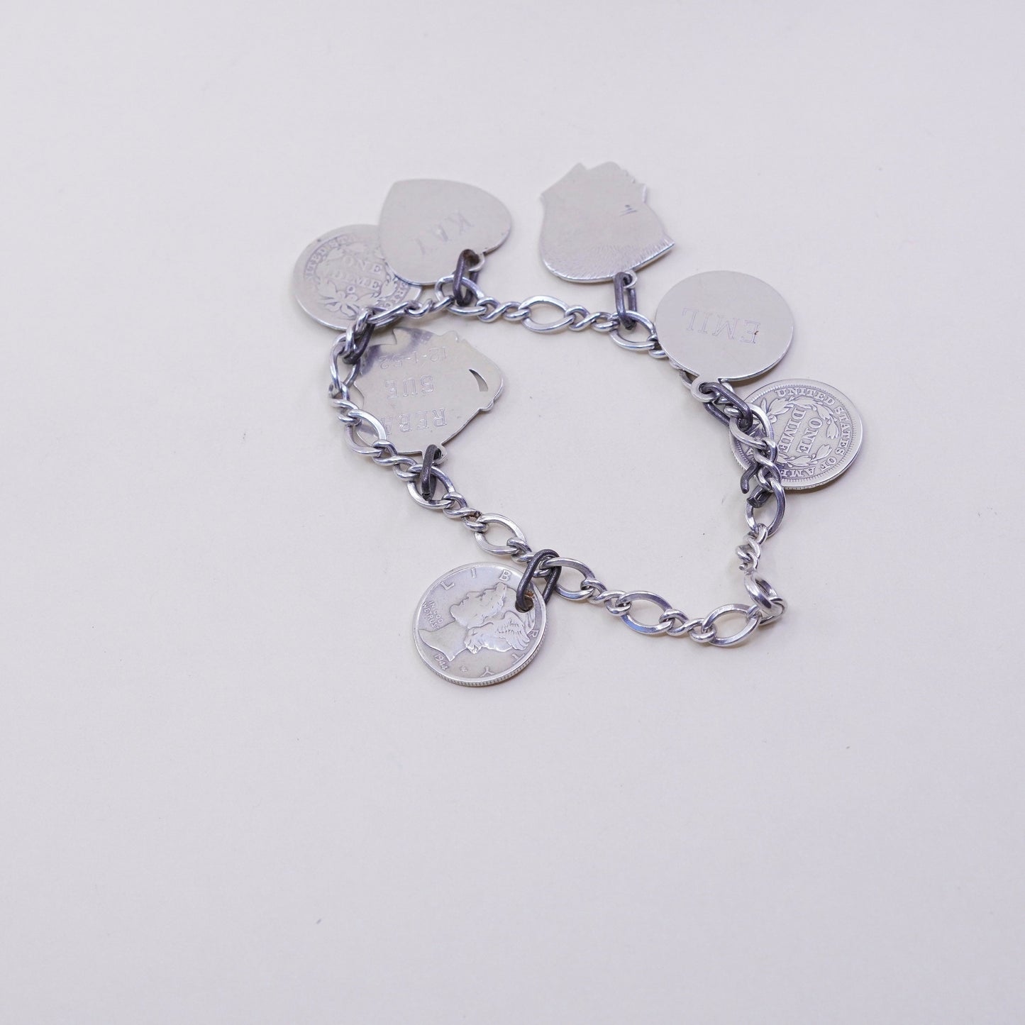 7”, sterling silver handmade bracelet, 925 Figaro chain w/ coin charms names