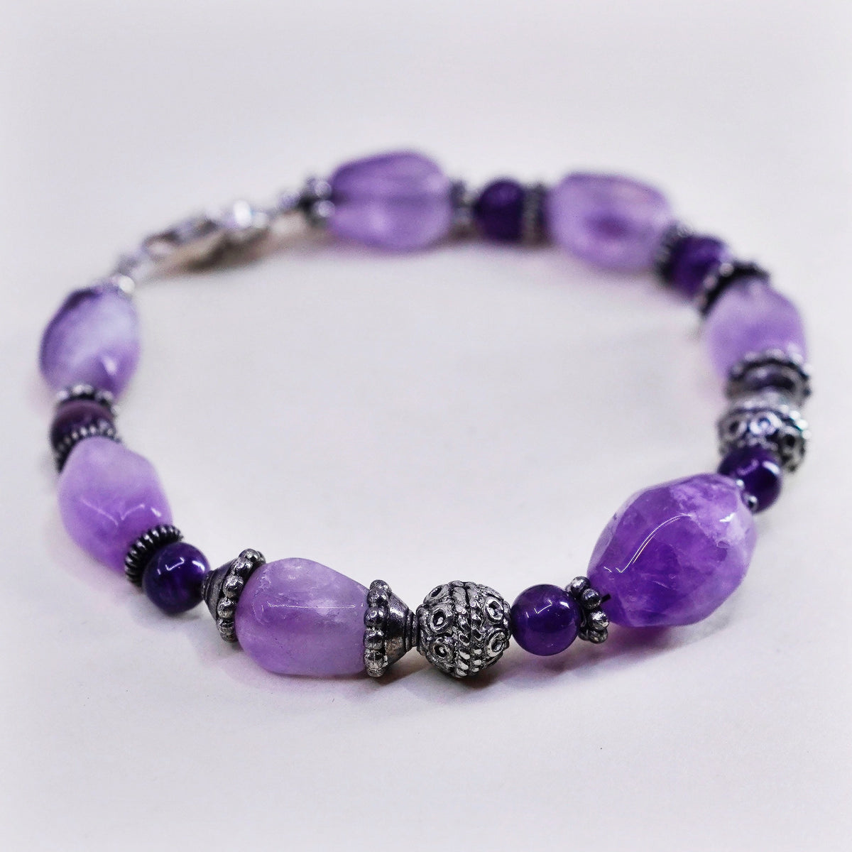 7.25” Sterling silver handmade bracelet, amethyst nuggets tiger eye beads