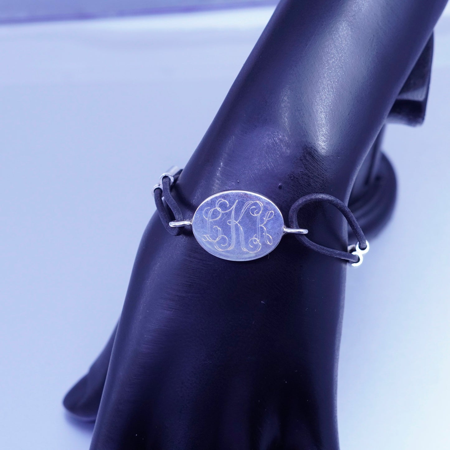 6.75”, sterling 925 silver handmade monogram “LKK” bracelet black leather core