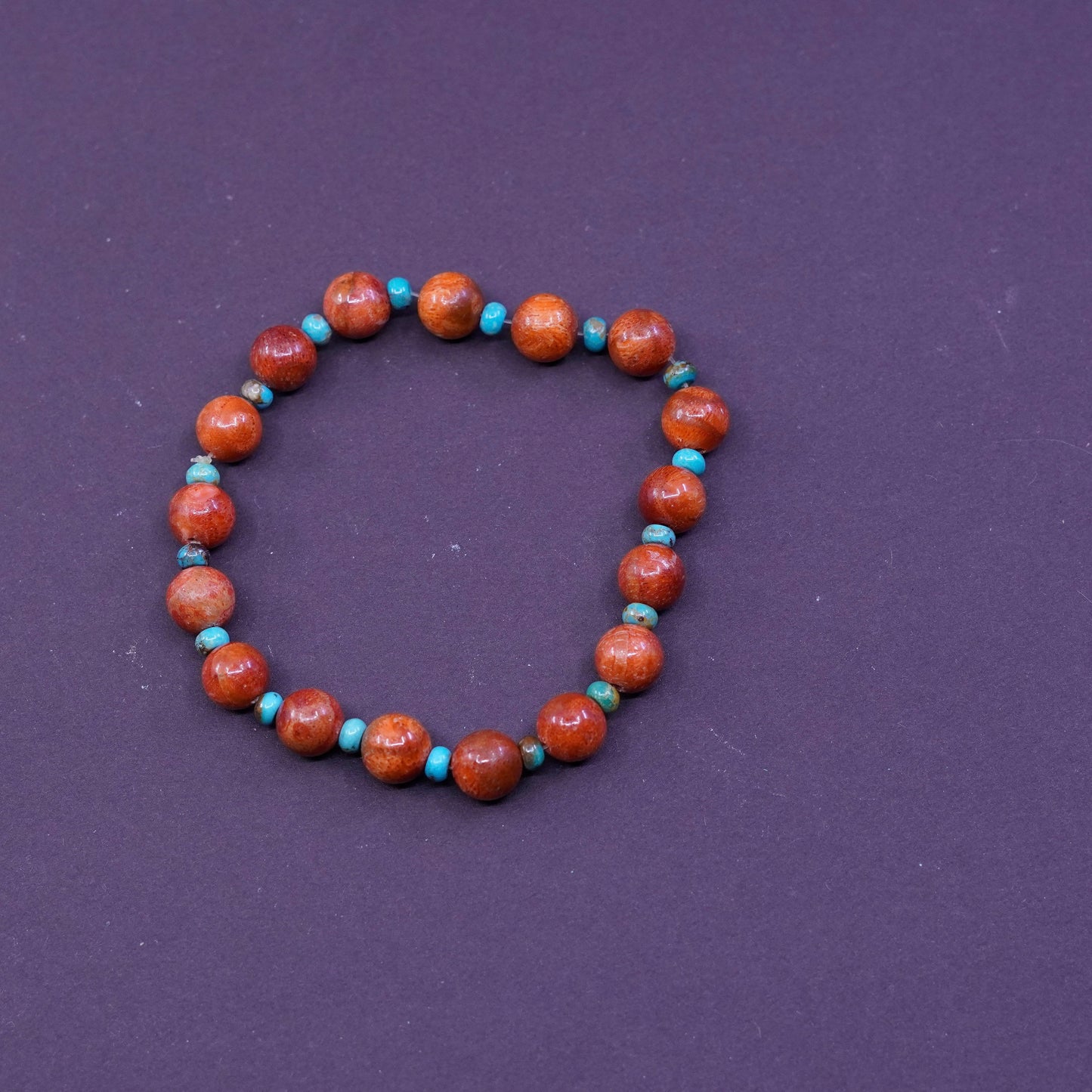 6.75”, vtg handmade bracelet, elastic band with red coral and turquoise beads