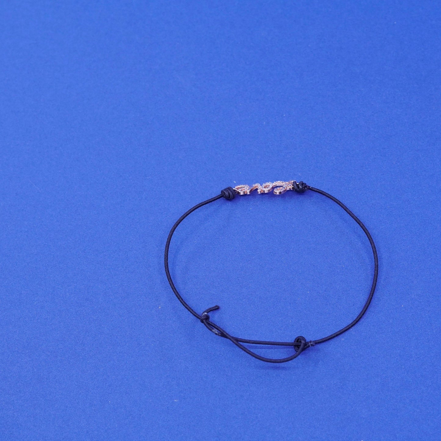 7.5”, vermeil gold over Sterling silver bracelet, elastic band “love” charm