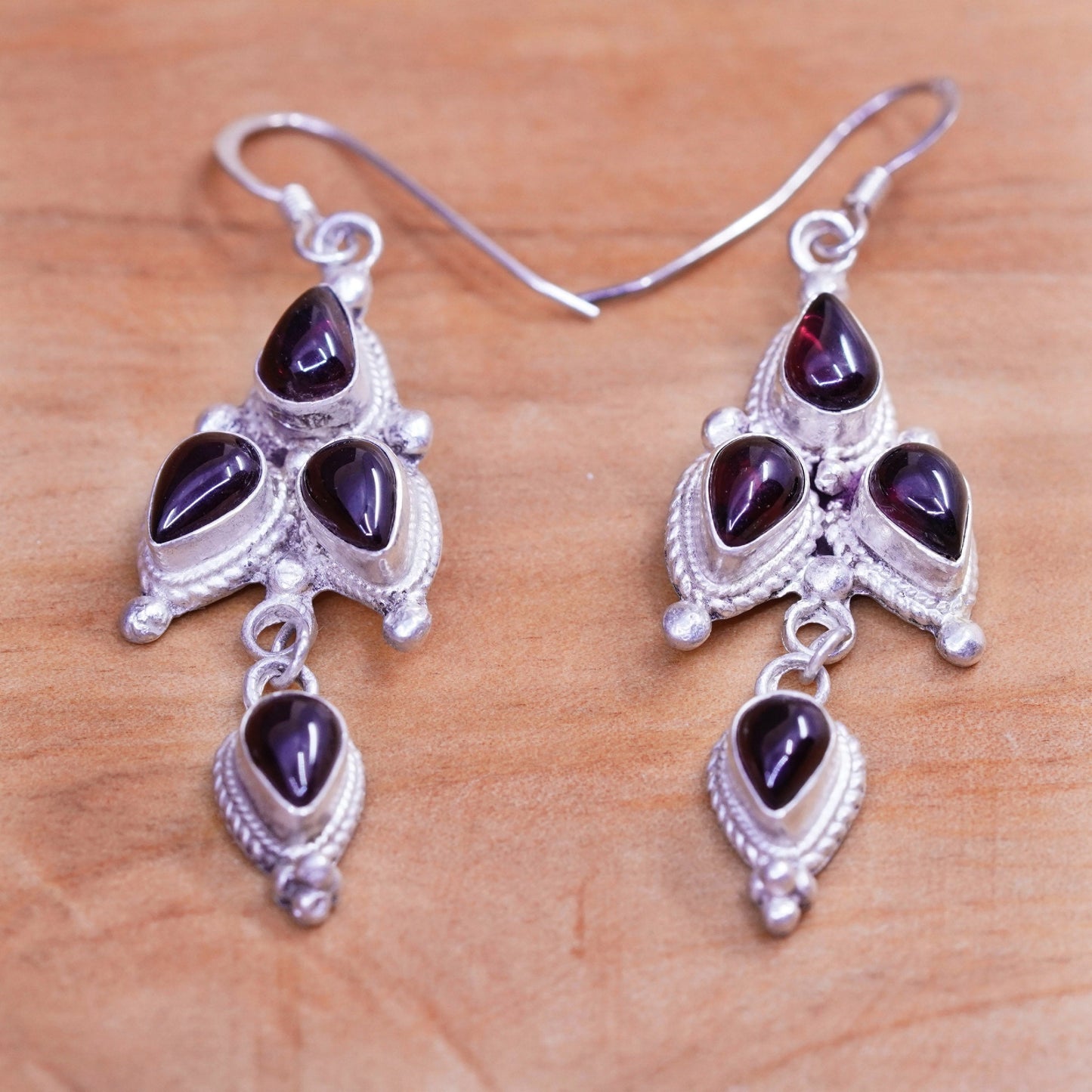 Vintage Nepal Sterling silver handmade earrings with teardrop garnet and cable