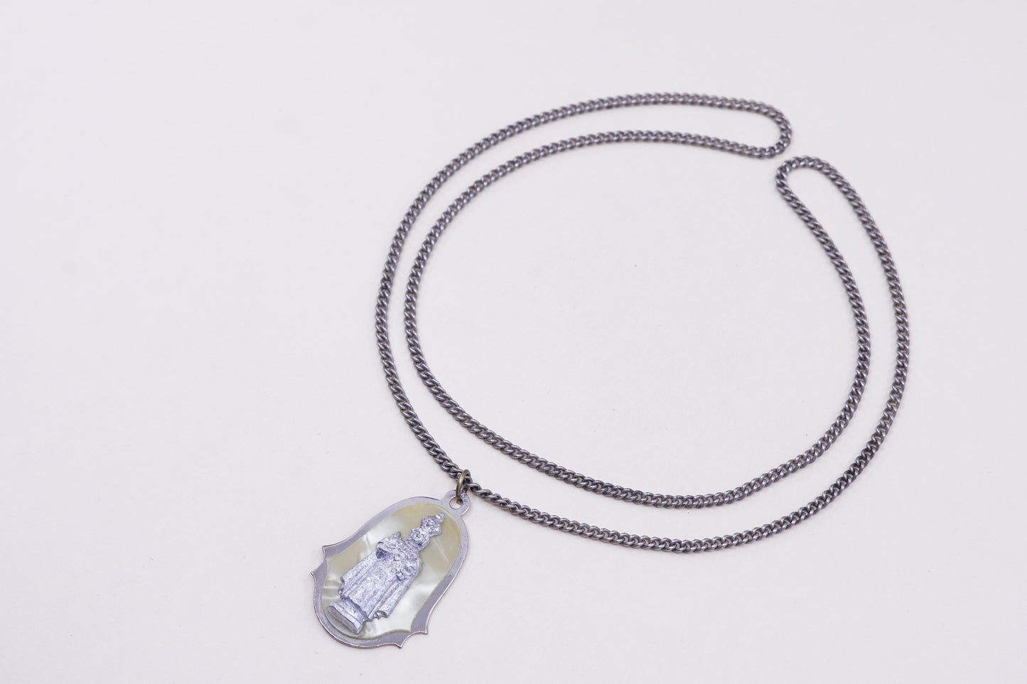 24”, vintage silver tone necklace with “queen” pendant