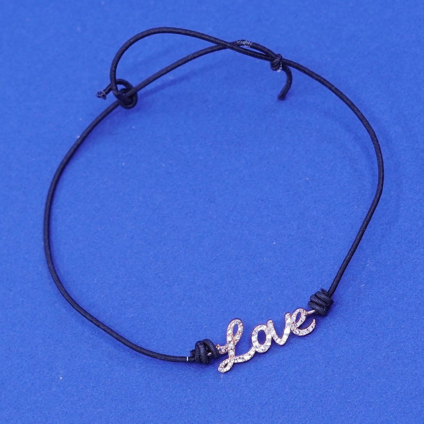 7.5”, vermeil gold over Sterling silver bracelet, elastic band “love” charm