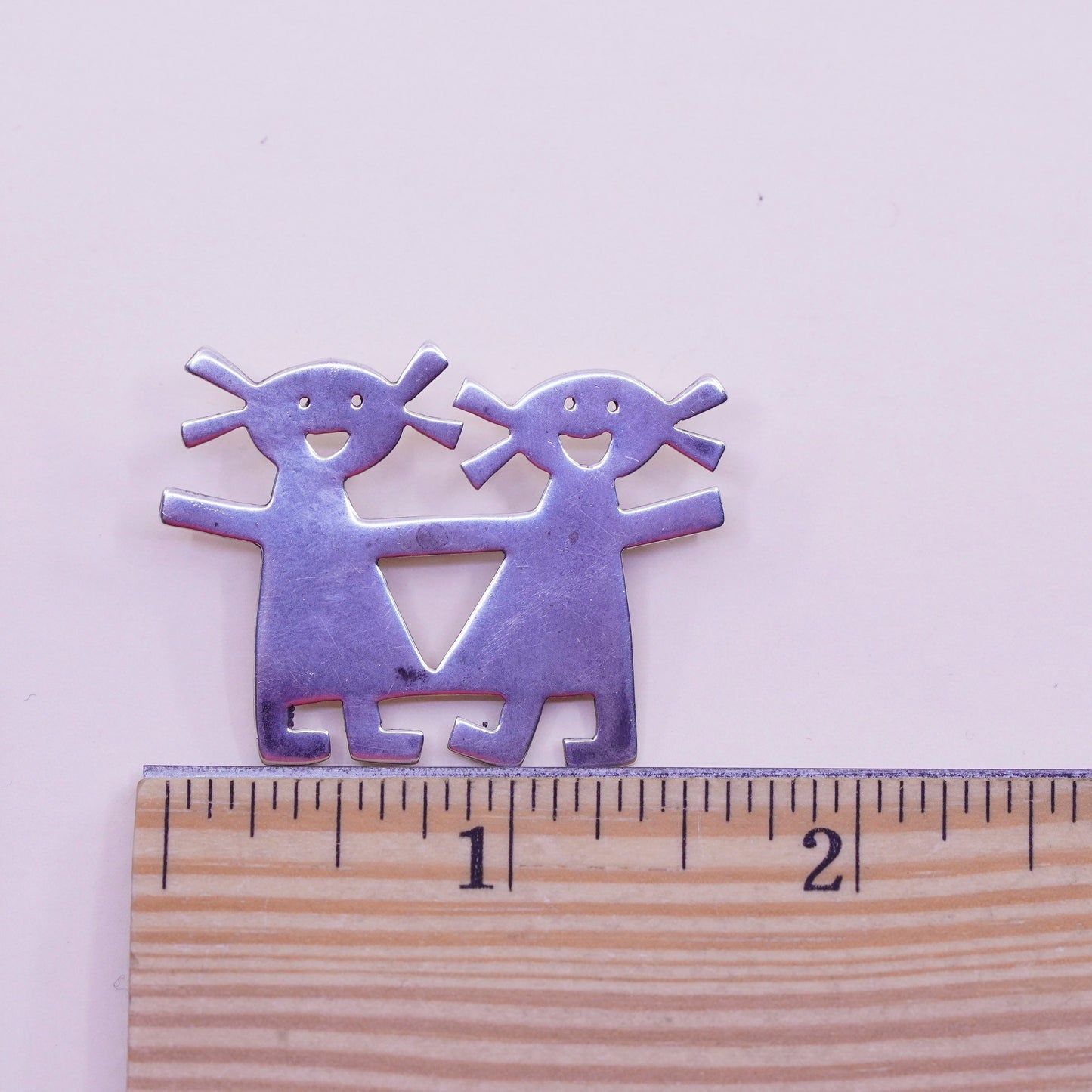 Vintage sterling 925 silver handmade brooch, two girls holding hands