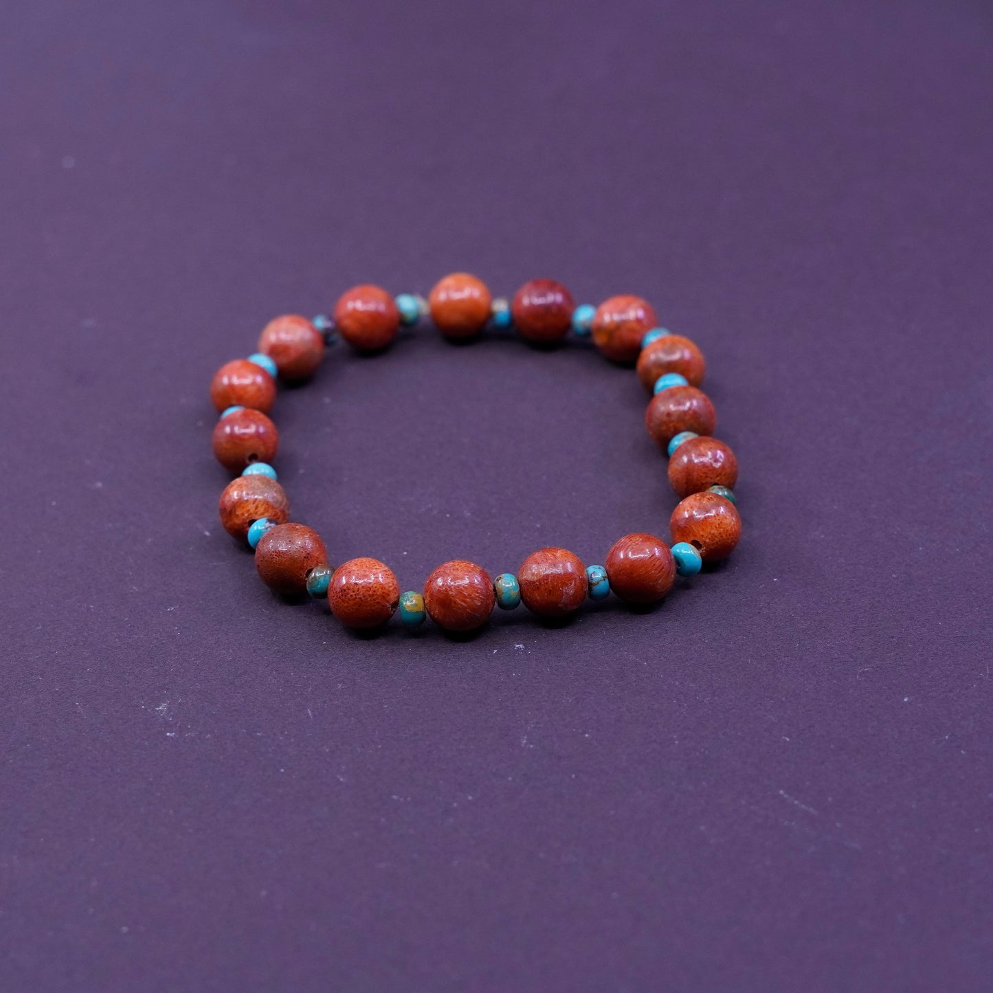 6.75”, vtg handmade bracelet, elastic band with red coral and turquoise beads