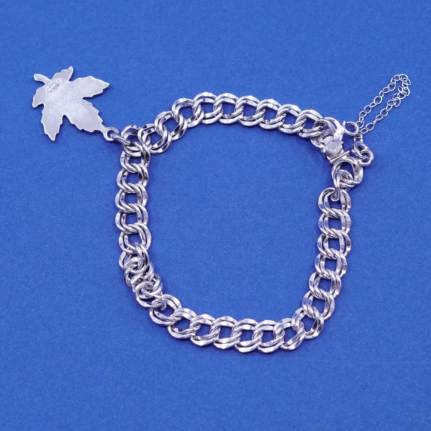 6.25”, Sterling silver bracelet, 925 double curb chain w/ Canada maple charm
