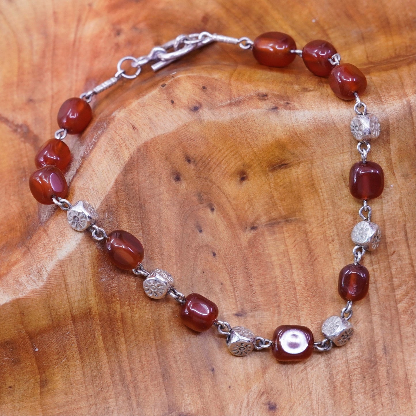 7.75”, vtg Sterling silver handmade garnet beads bracelet with toggle closure
