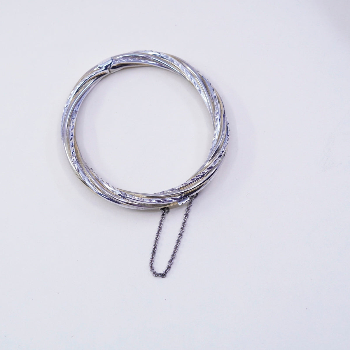 7.25”, two tone sterling silver bracelet, 925 hinged diamond twisted bangle
