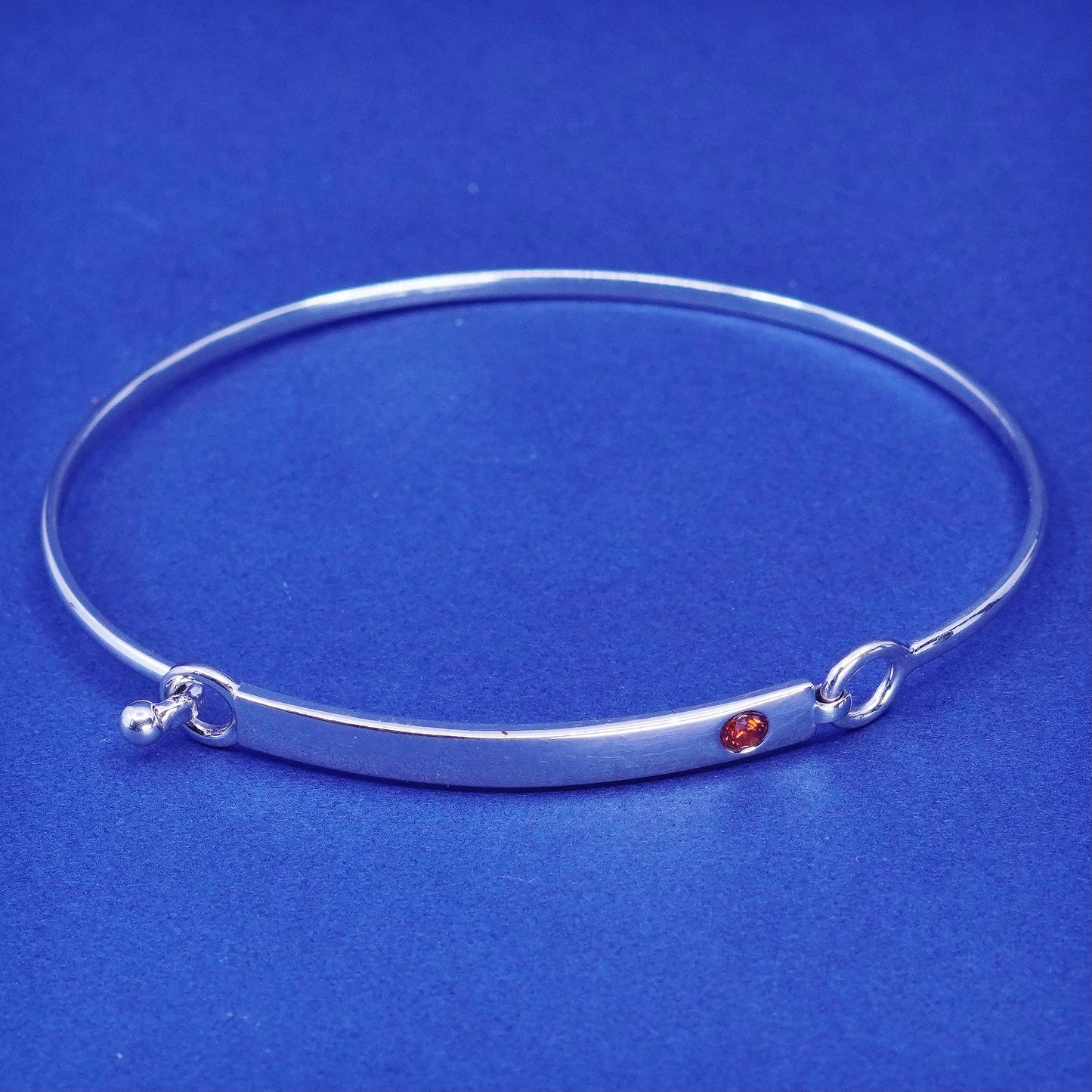 7.5”, Elle Sterling silver bracelet, 925 matted glitter hinged bangle with ruby