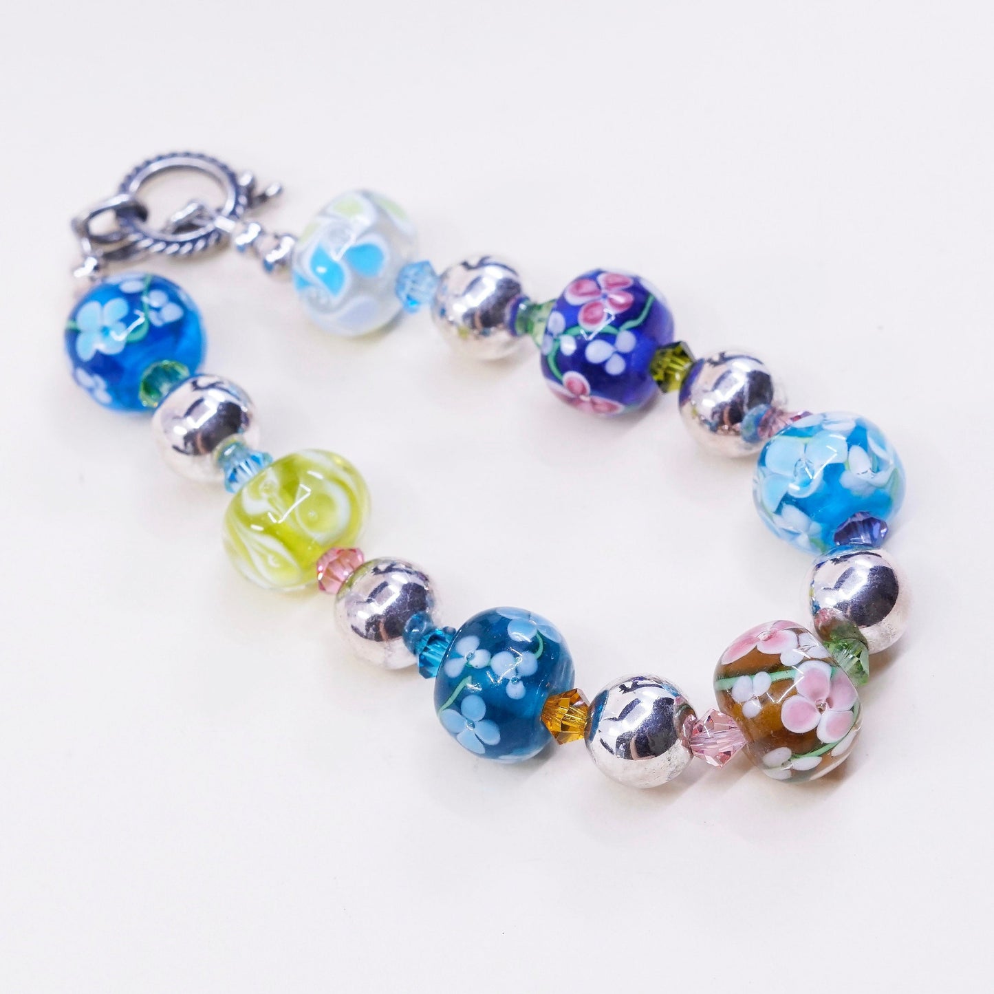 6.75”, vtg 925 Sterling silver bracelet w/ artisan floral glass beads N toggle