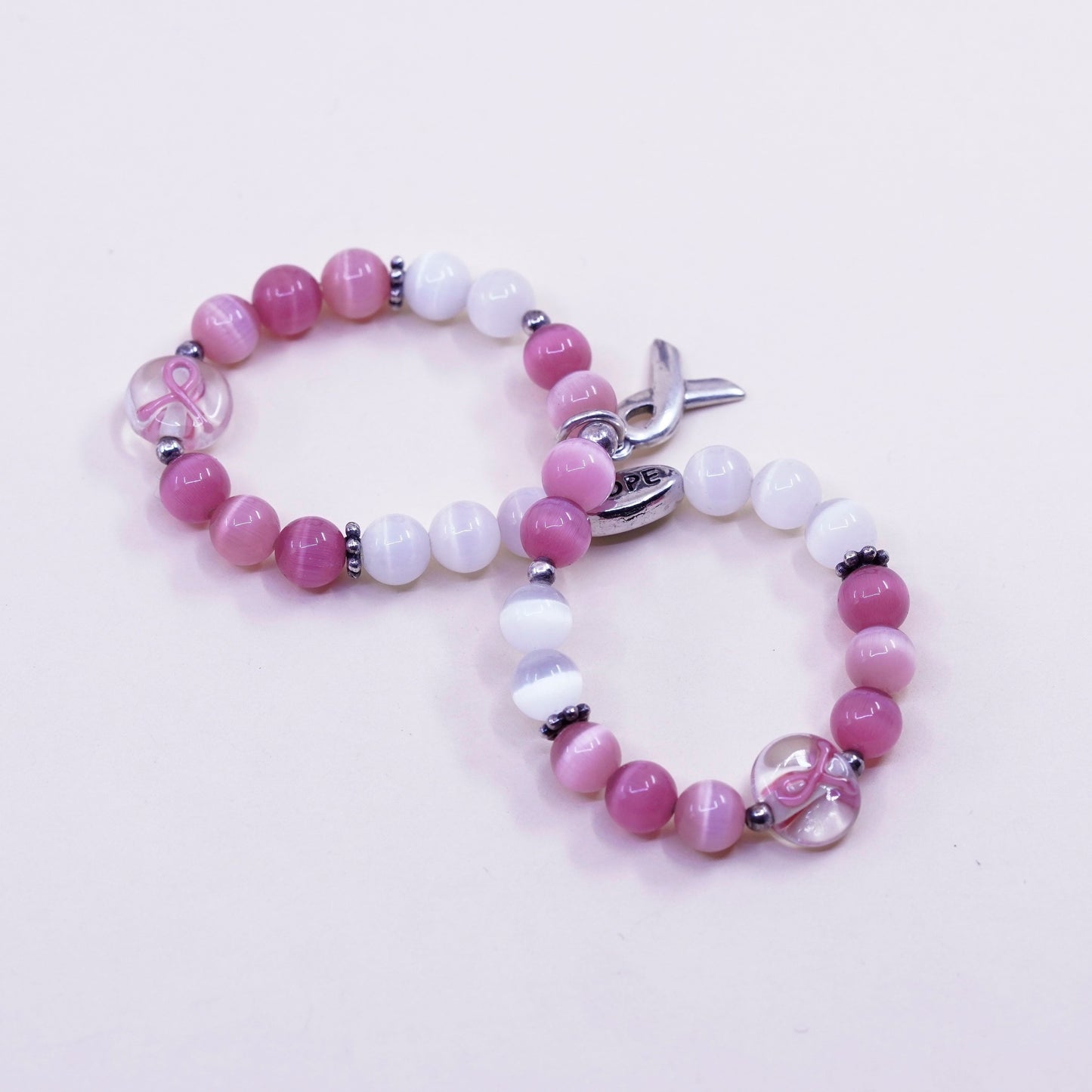7.5”, “Hope” bracelet, pink cats eye beads elastic band 925 ribbon bow tie