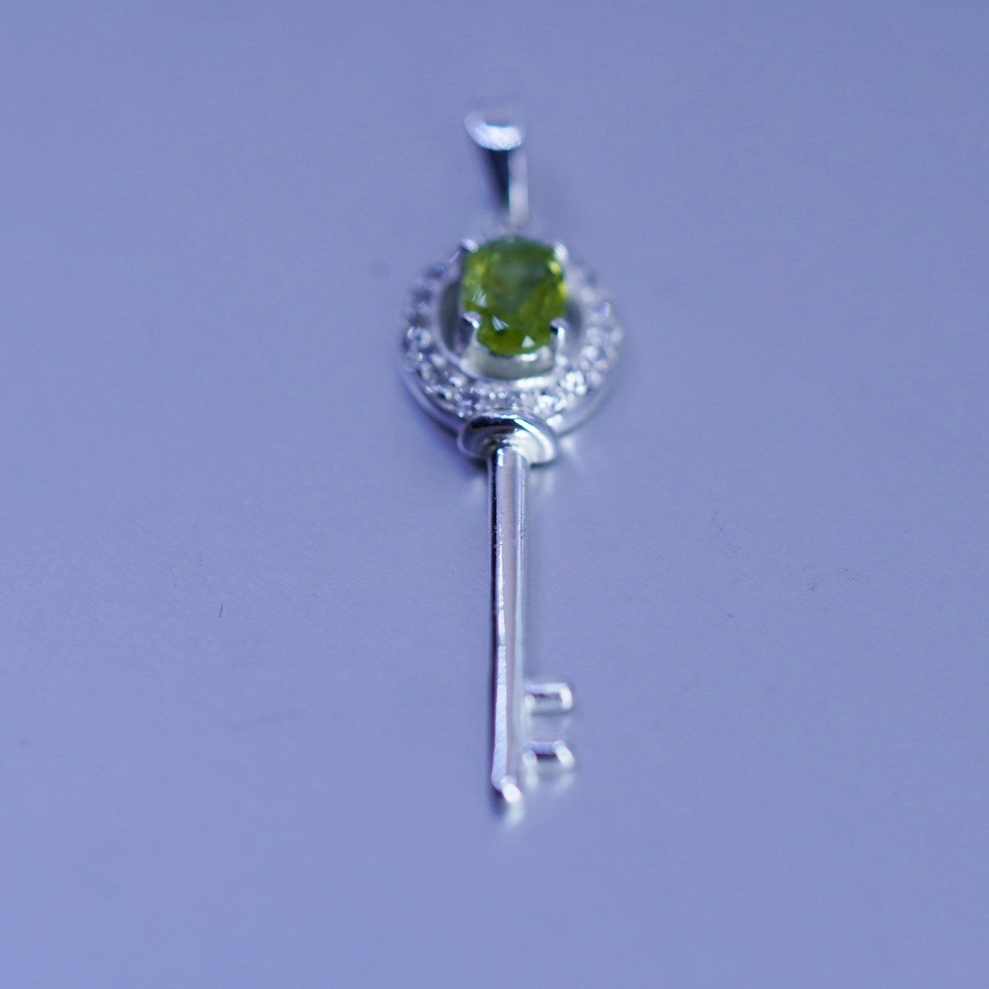 Vintage sterling 925 silver key pendant with peridot and cz