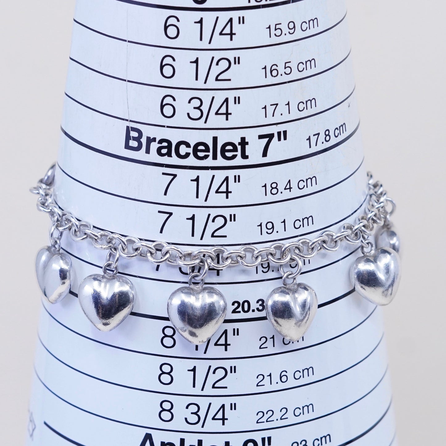 7.75”, 3mm, vtg JCM sterling 925 silver circle bracelet w/ cluster heart charms