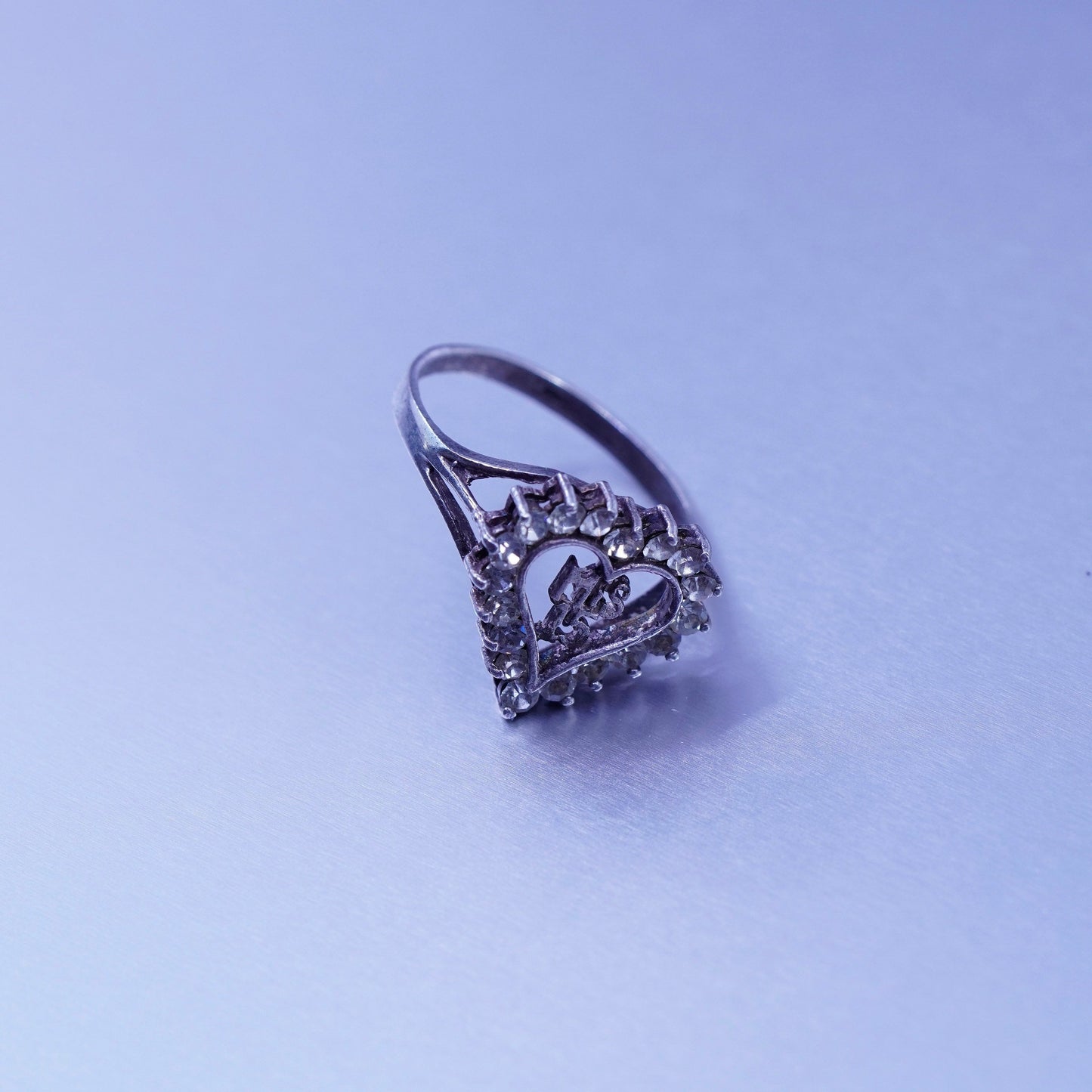 Size 7.5, vintage Avon Sterling 925 silver engagement ring with Cz and “mis 15”