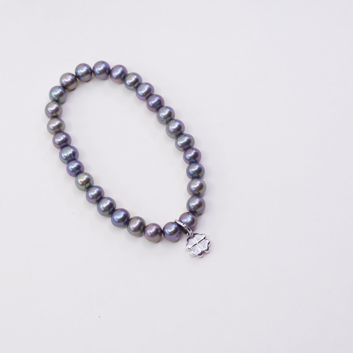 7”, bracelet, black pearl with elastic band and 925 silver lucky clover charm,