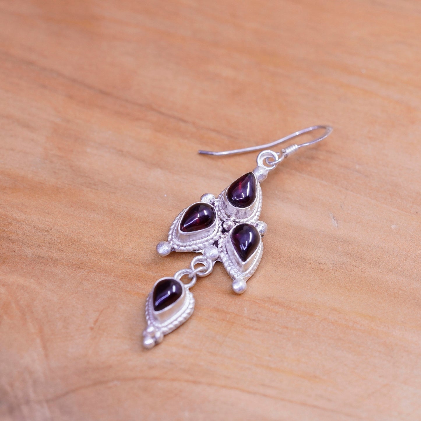 Vintage Nepal Sterling silver handmade earrings with teardrop garnet and cable