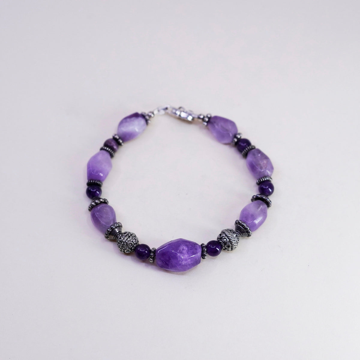 7.25” Sterling silver handmade bracelet, amethyst nuggets tiger eye beads