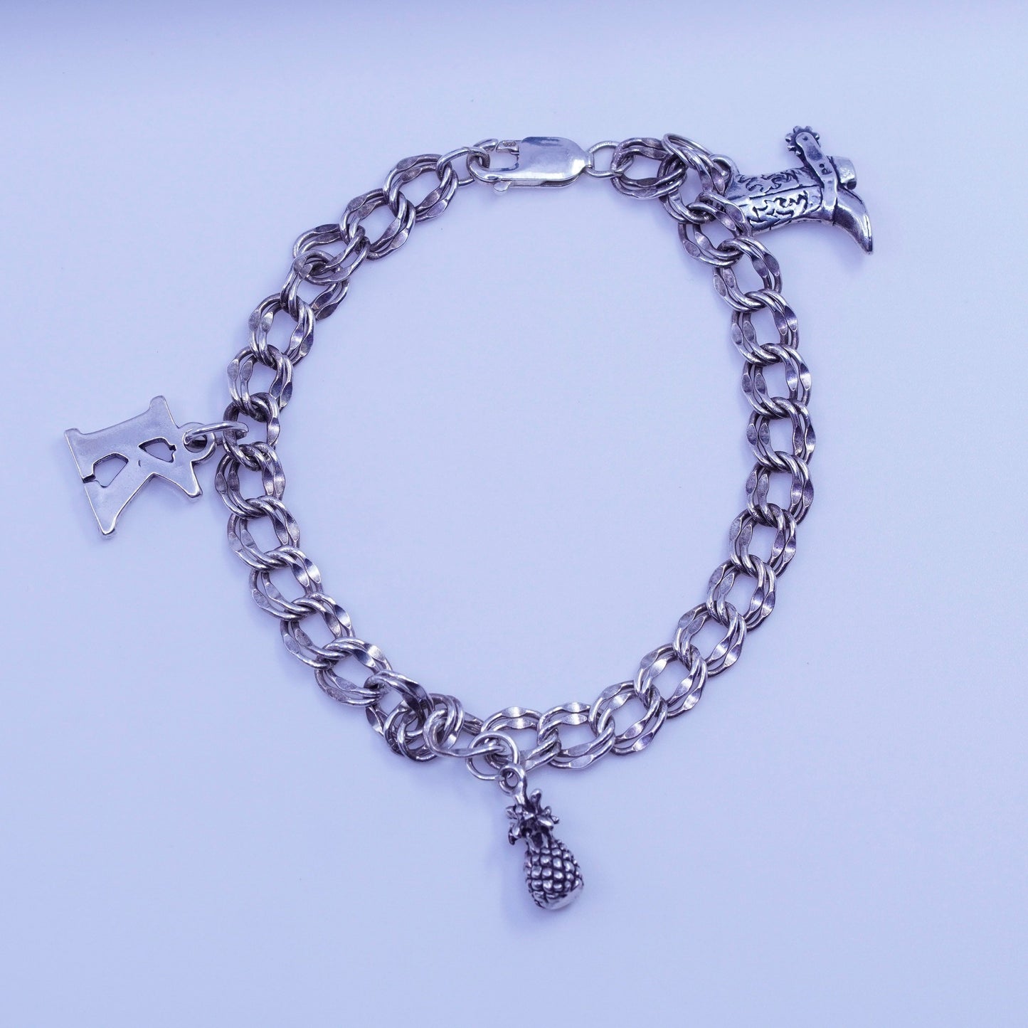 7.5”, Sterling 925 silver bracelet, curb chain K pineapple riding boot charms