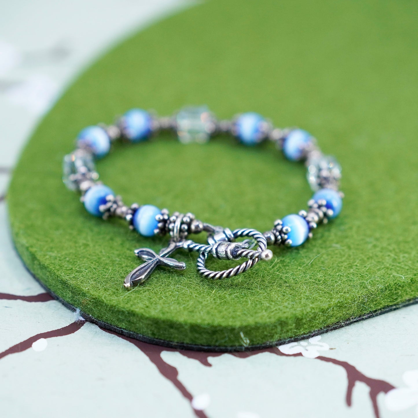 6”, Mexico 925 sterling silver bracelet with blue cats eye bead and cross charm