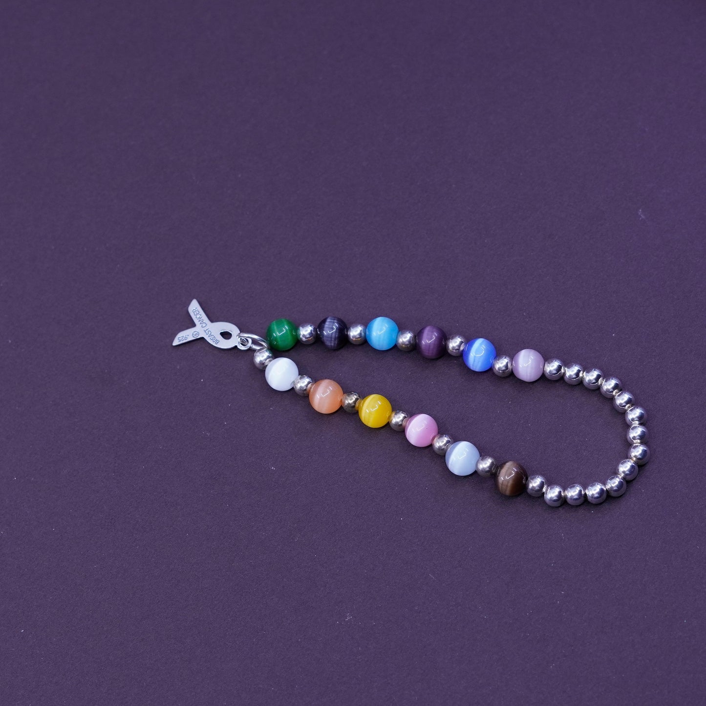 6”, Sterling 925 silver bracelet, elastic band with colorful cat eyes and beads