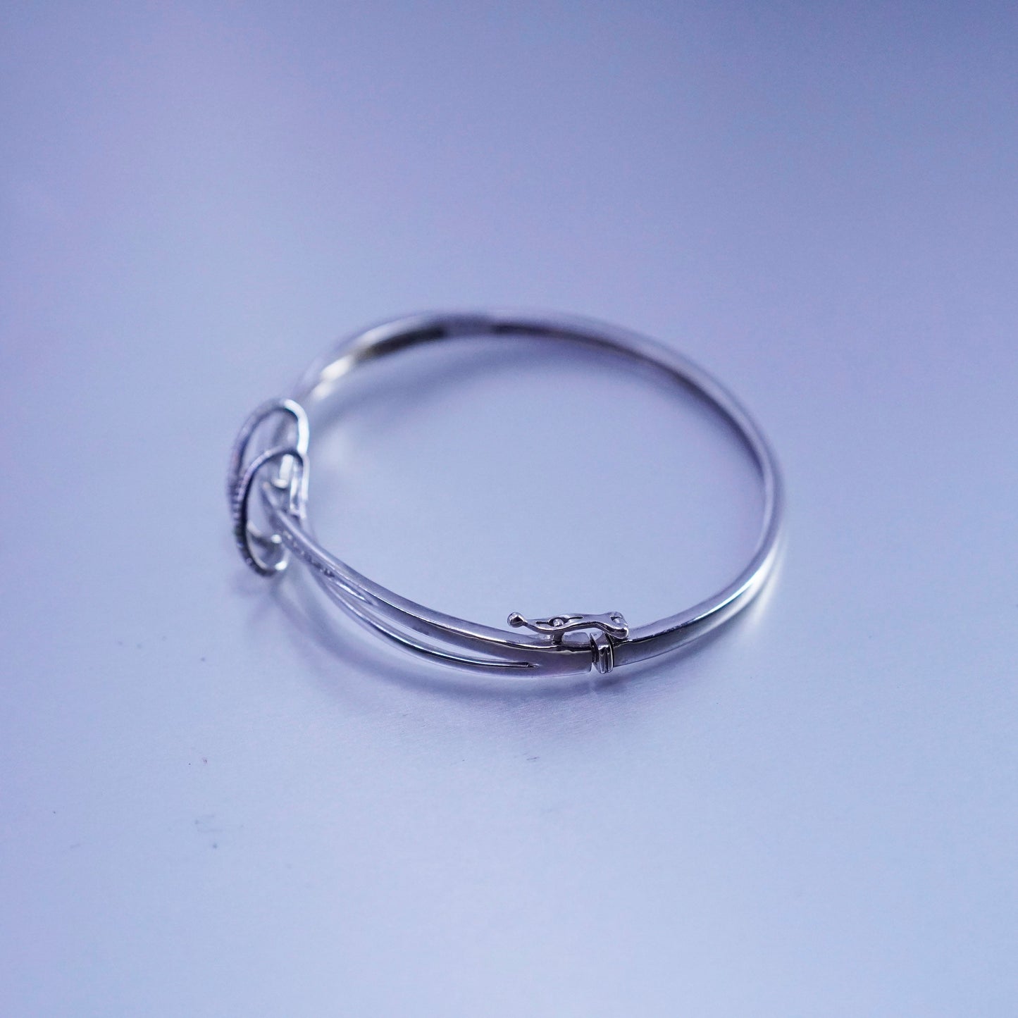 7”, Sterling 925 silver bracelet, entwined hinged bangle with cluster diamonds